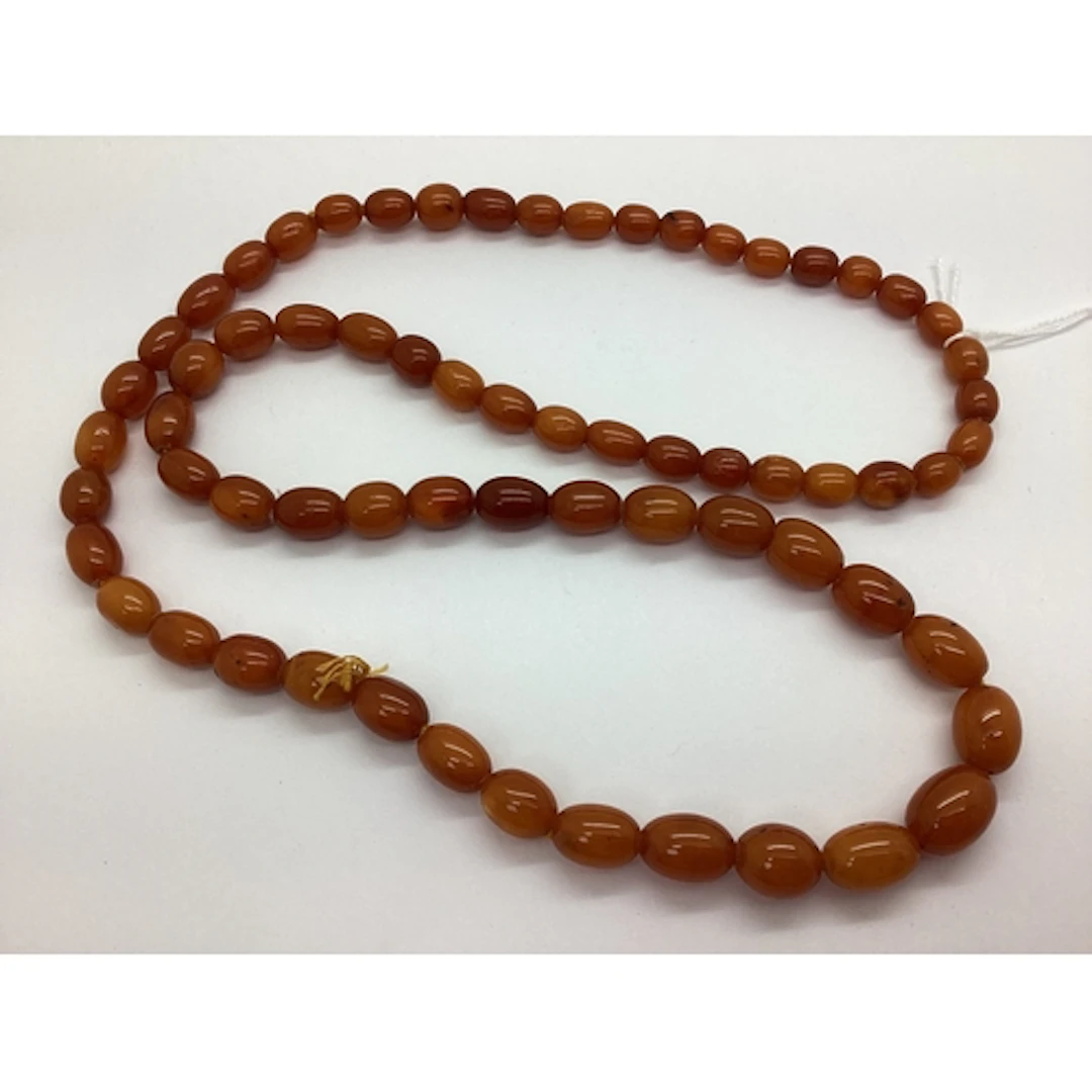 A Single Strand Graduated Amber Colour Bead Necklace, approx...