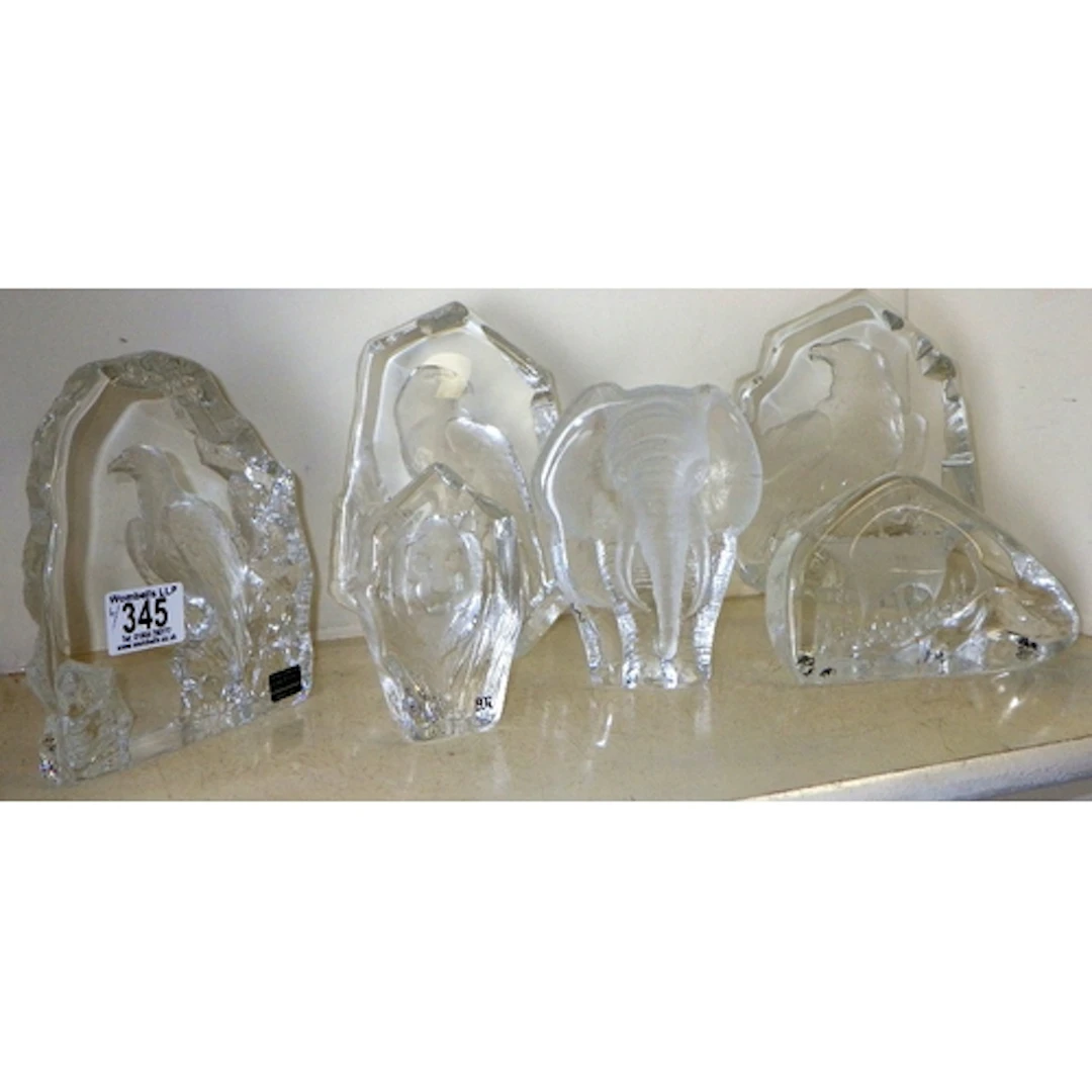 A group of Mats Jonasson paperweights