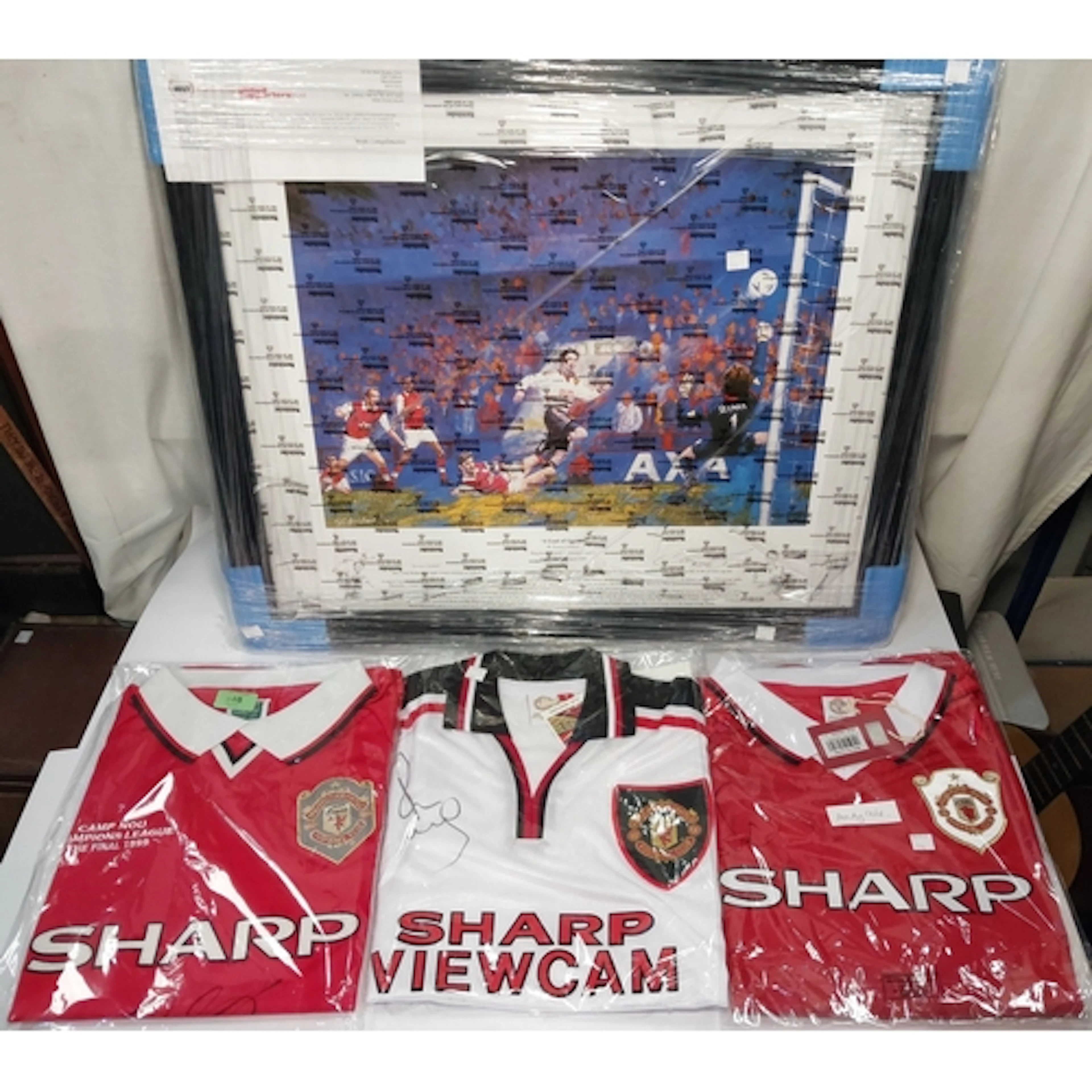 3 signed retro Manchester United shirts and a Manchester Uni...