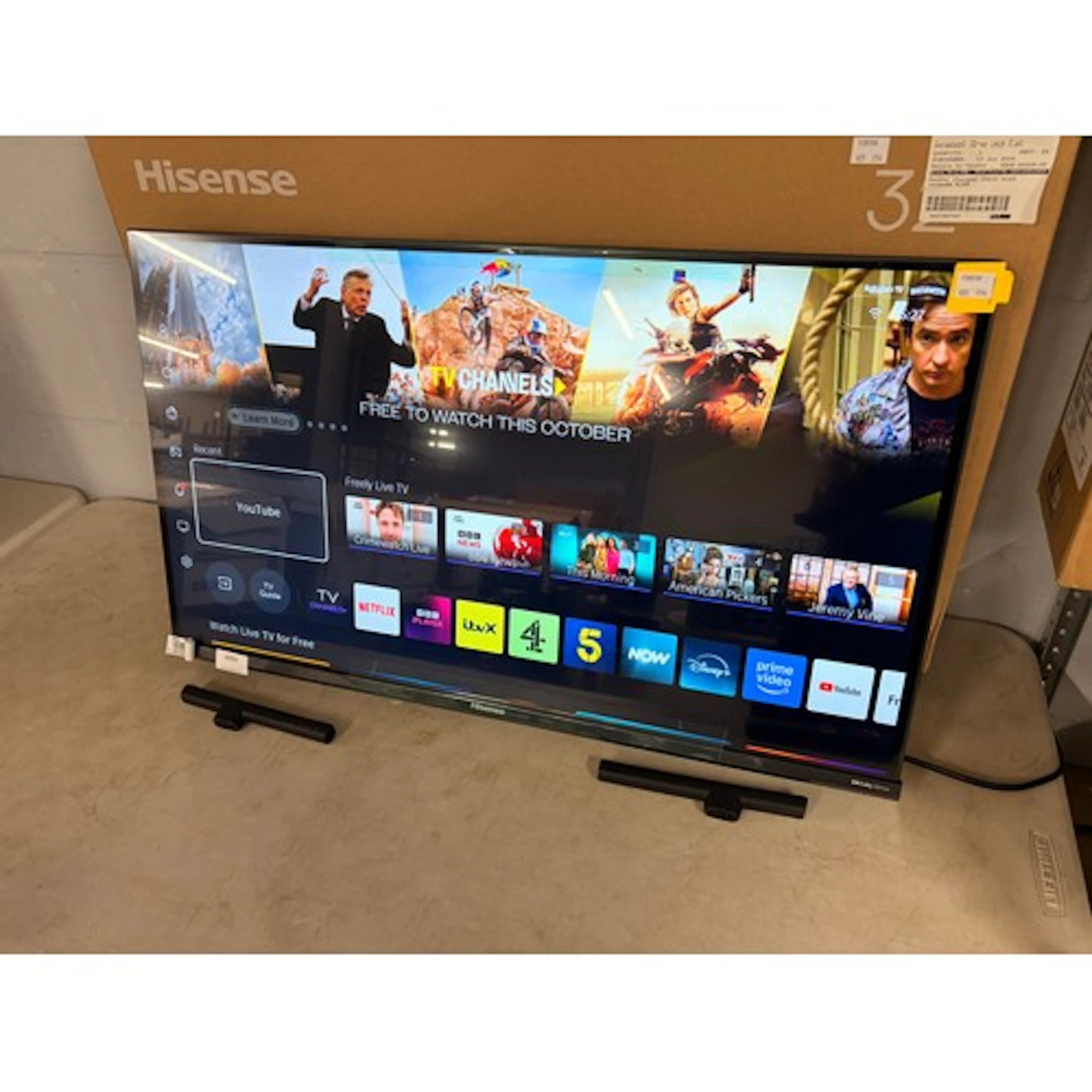 A Hisense 32" QLED smart Television with remote and stand, o...
