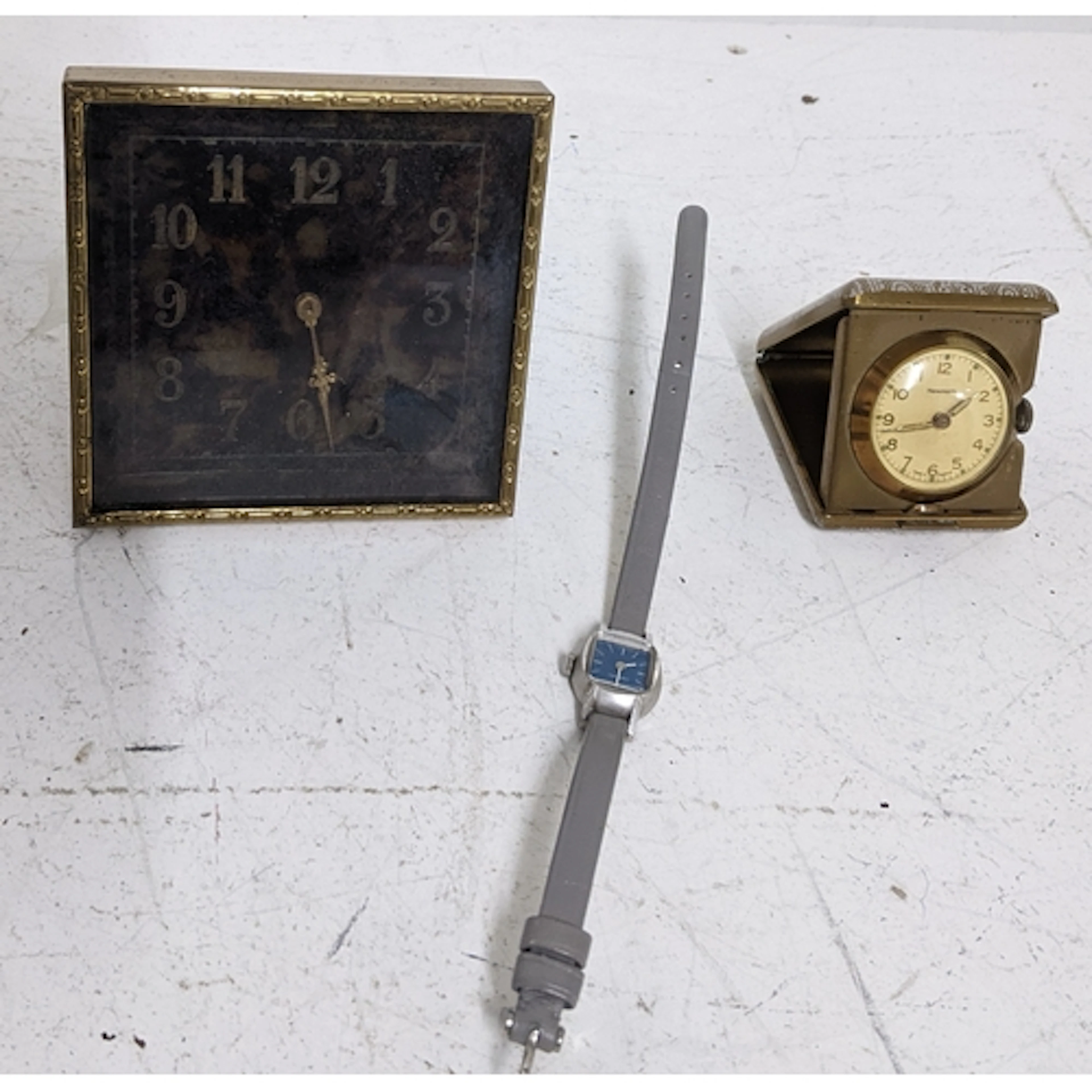 A gilt brass framed dressing table strut clock with faux tor...