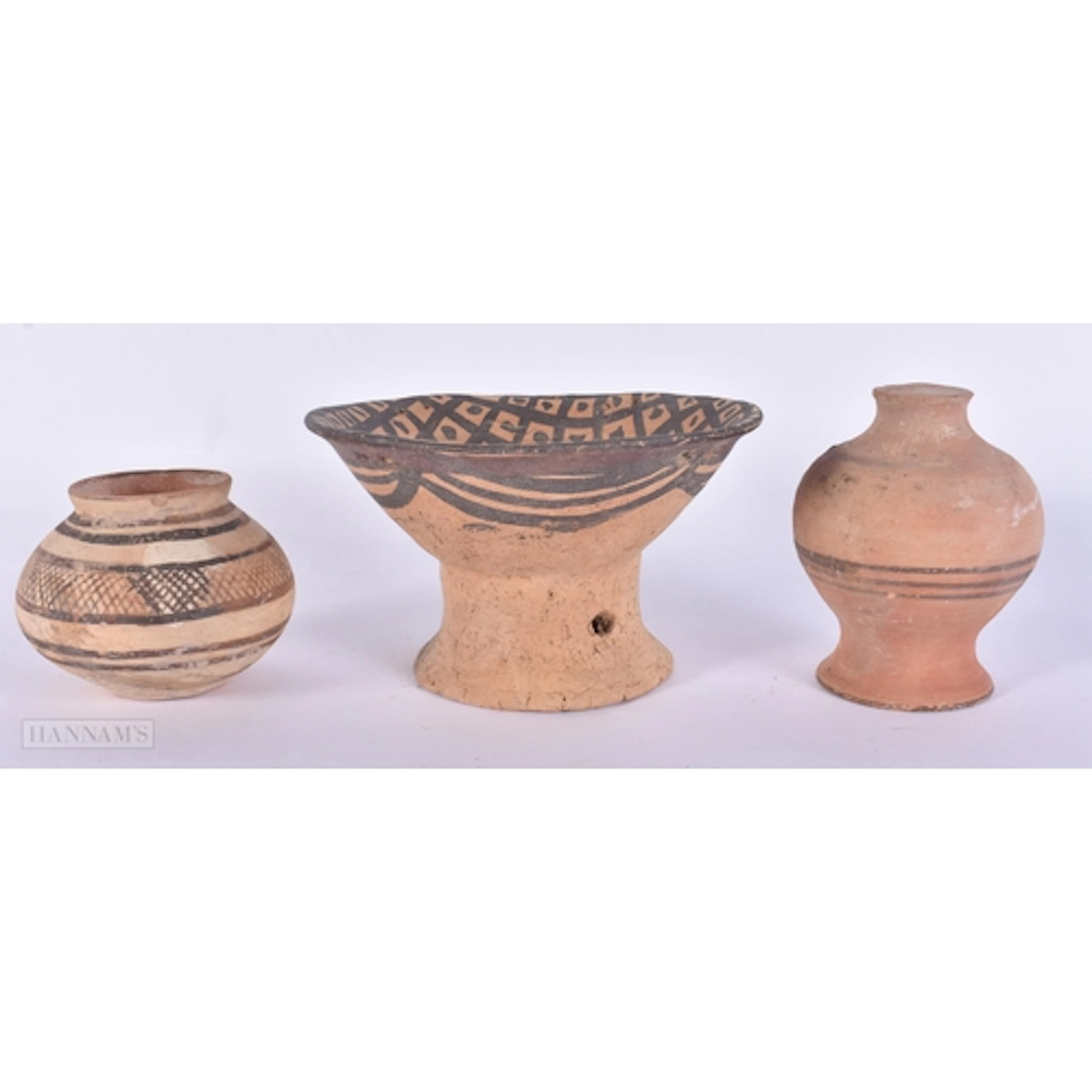 A CHINESE NEOLITHIC PERIOD POTTERY FOOTED BOWL together with...