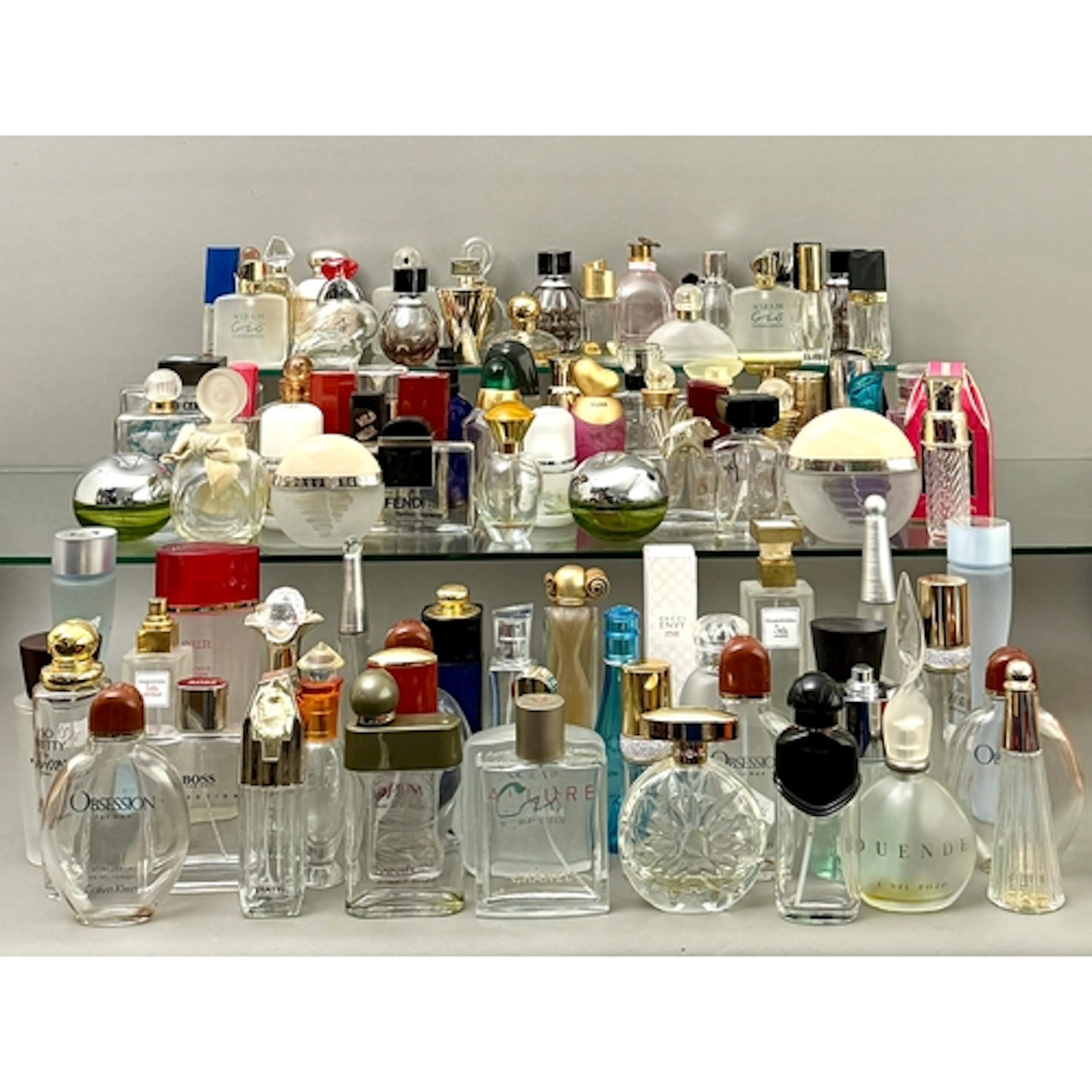 A large collection of vintage perfume bottles - including Gu...