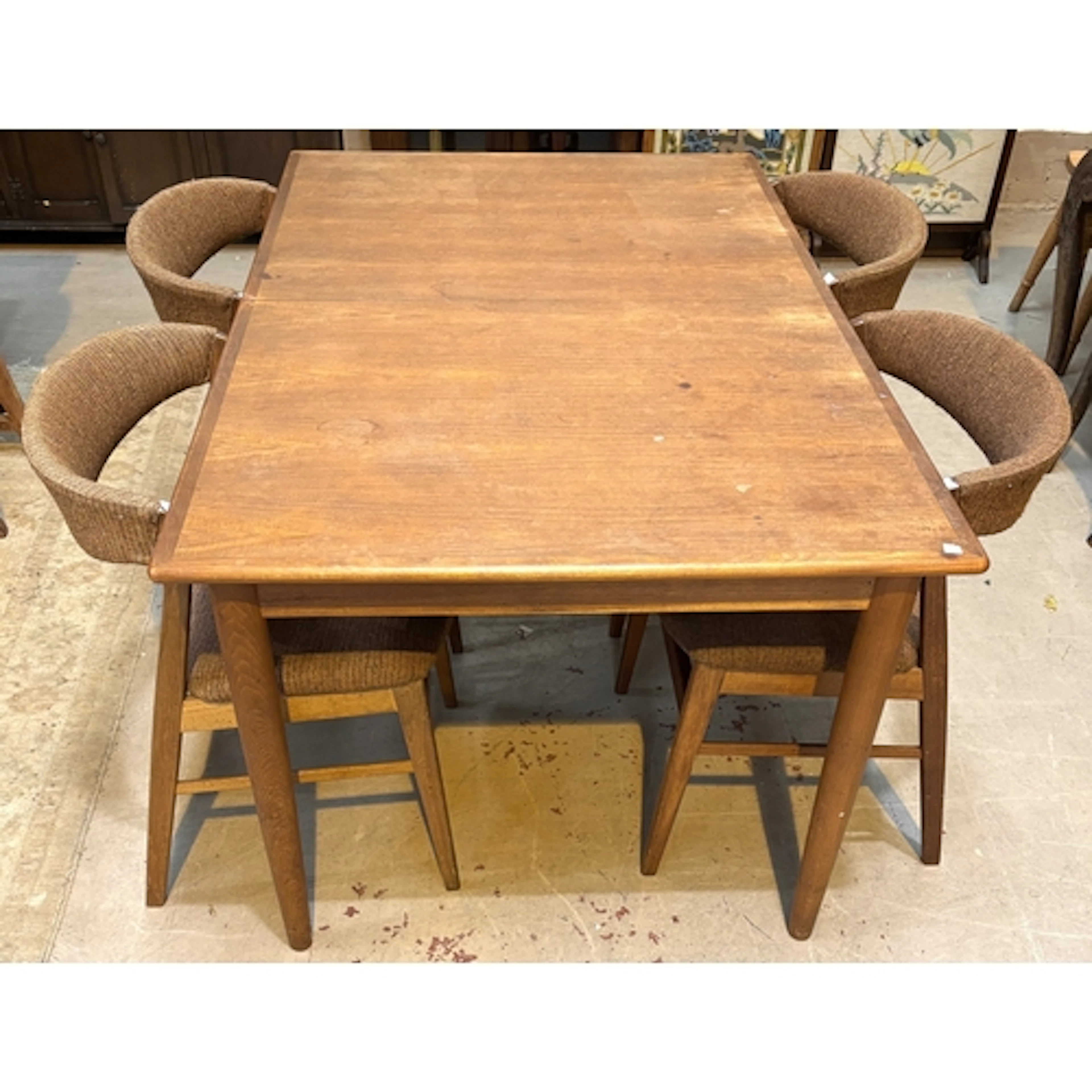 A mid 20th century Dyrlund teak rectangular extending dining...