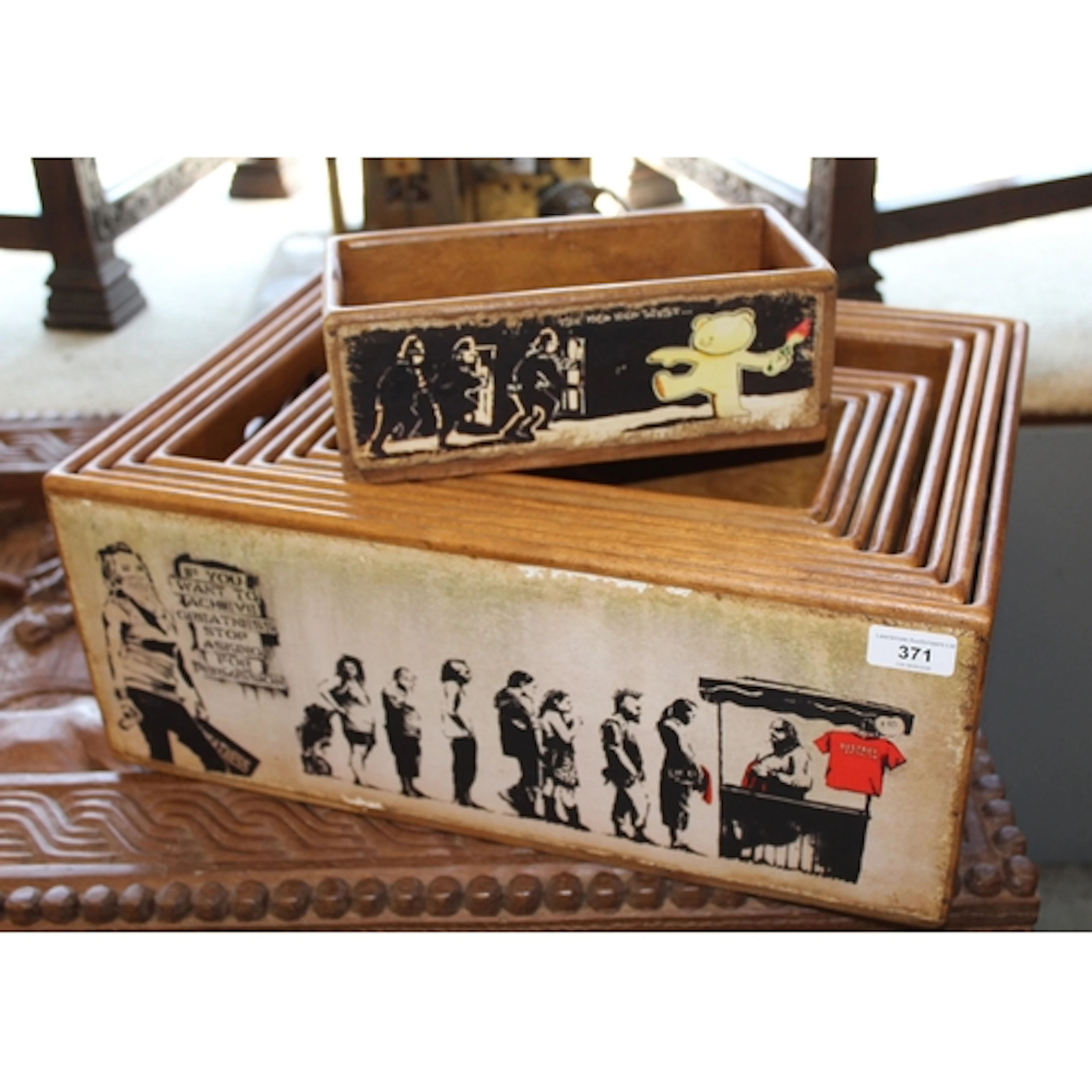 Graduated set of rectangular wooden boxes decorated with pri...