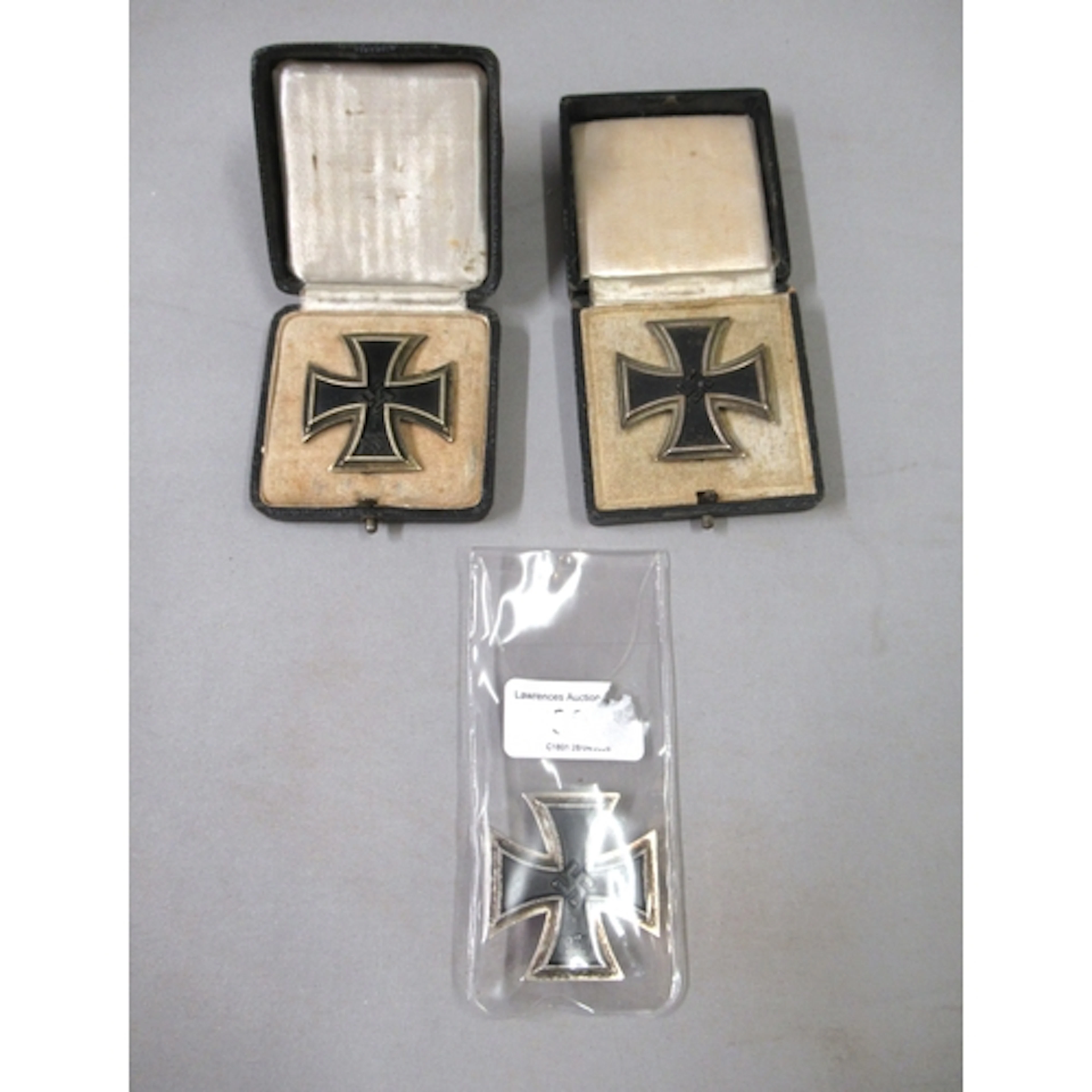1939 German Iron Cross badge, together with two similar copy...