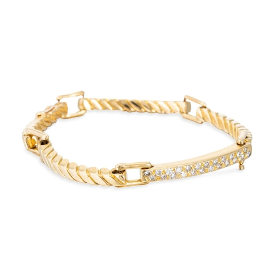 A VINTAGE VAN CLEEF & ARPELS DIAMOND SET BRACELET, the centr...
