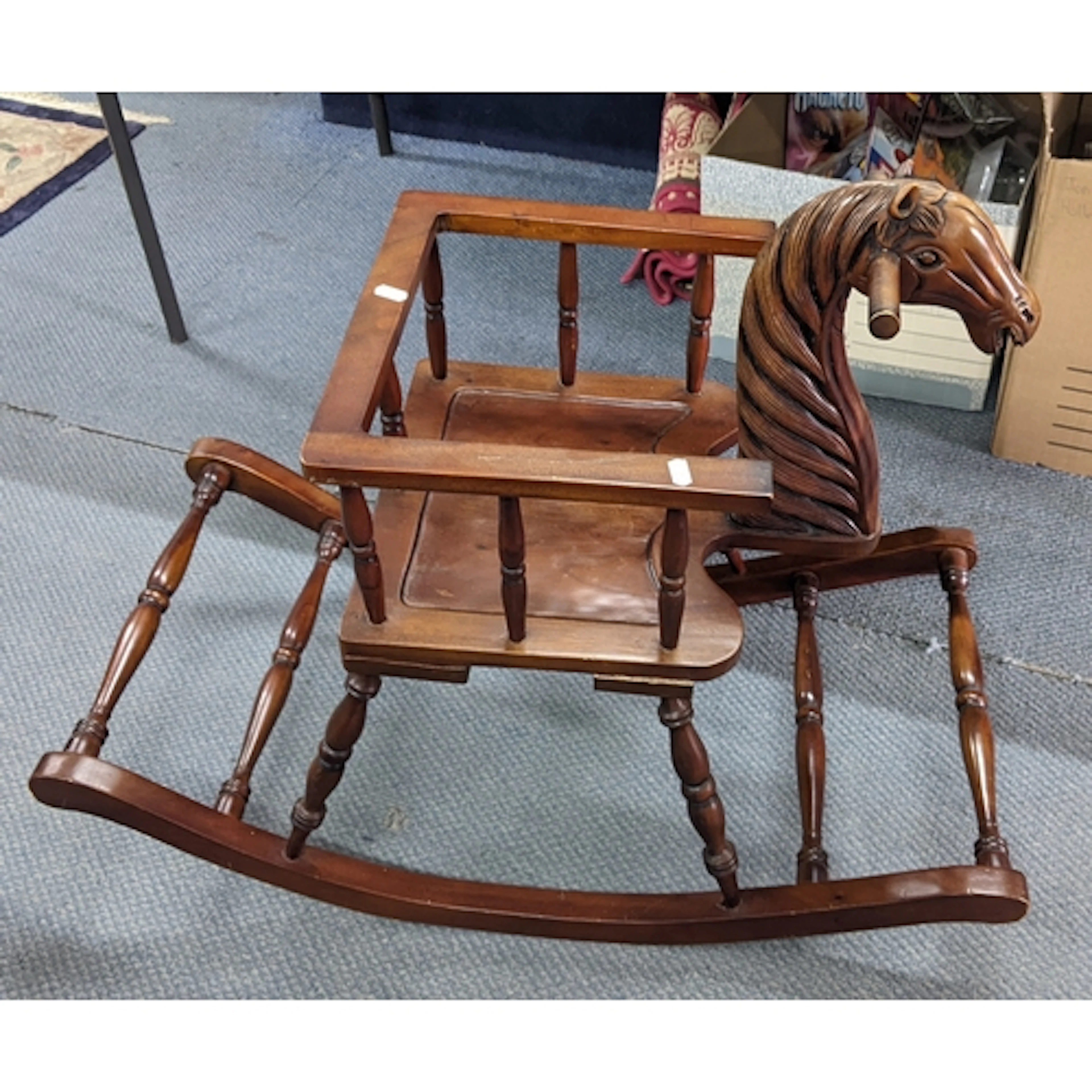 A late 20th century hardwood rocking chair the front modelle...