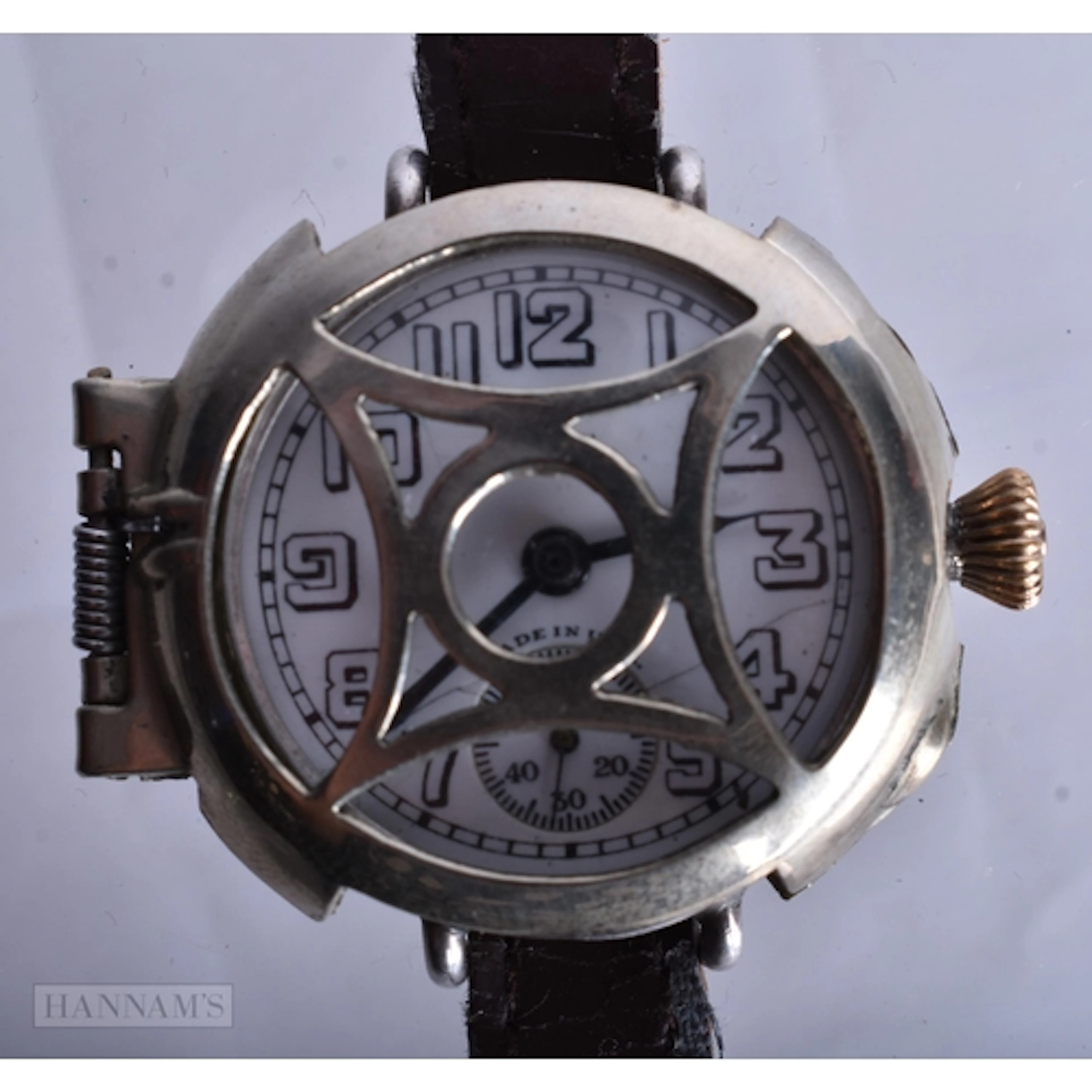 AN ELGIN FACE GRILL WRIST WATCH. Running. 3.25 cm wide.