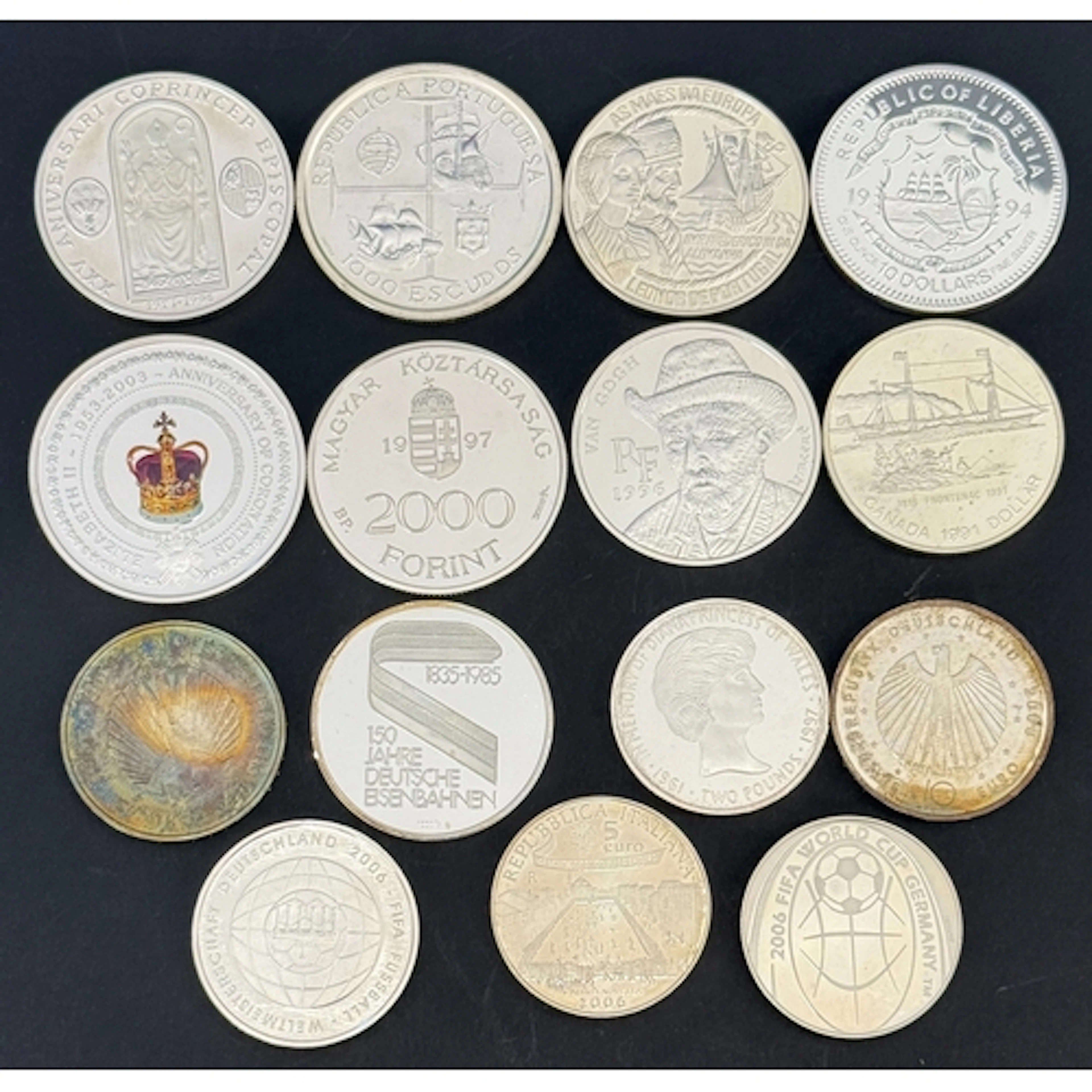 A group of 15 World silver commemorative coins, comprising A...