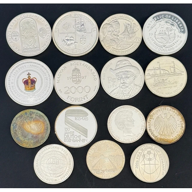 A group of 15 World silver commemorative coins, comprising A...