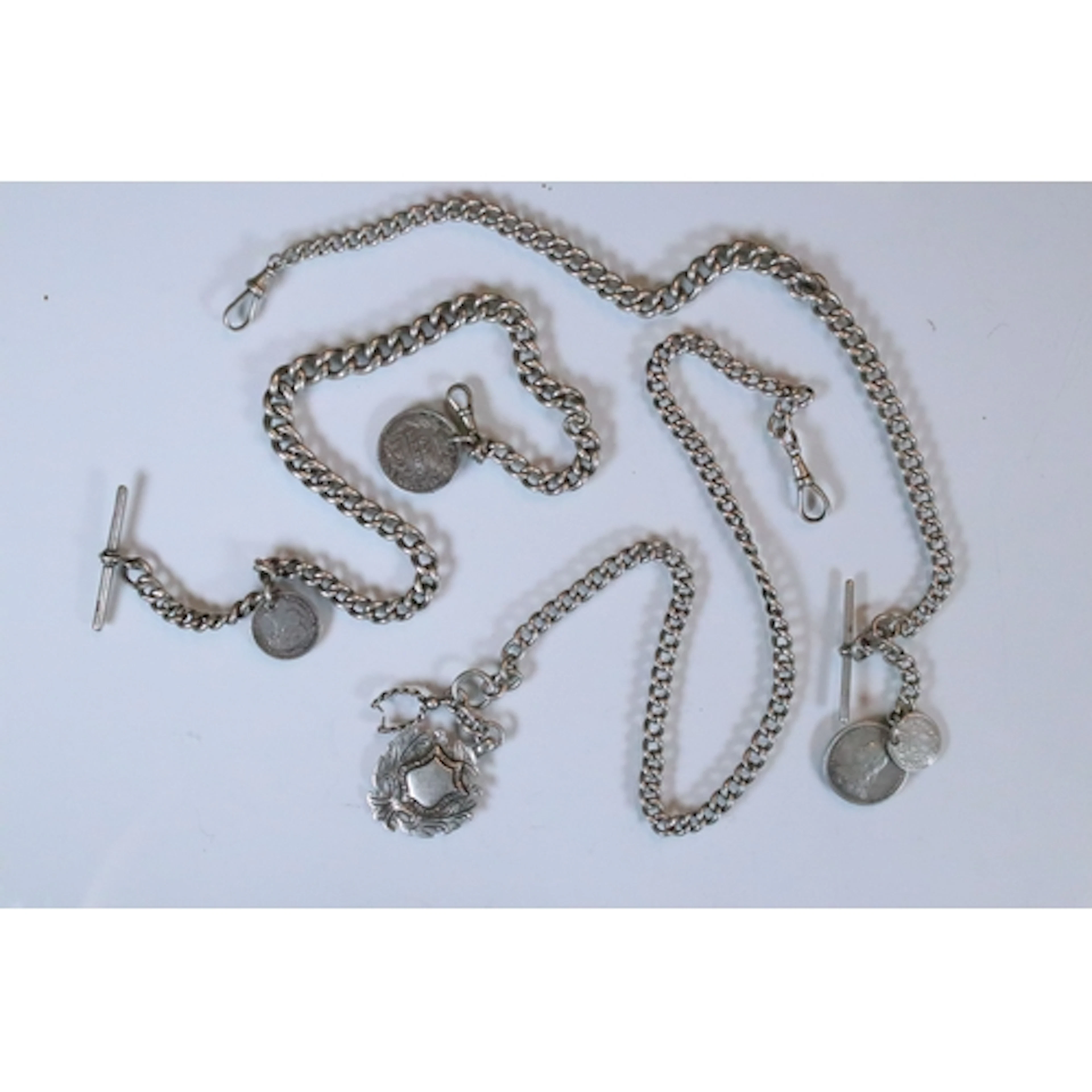 Group of three silver curb link pocket watch chains, all thr...