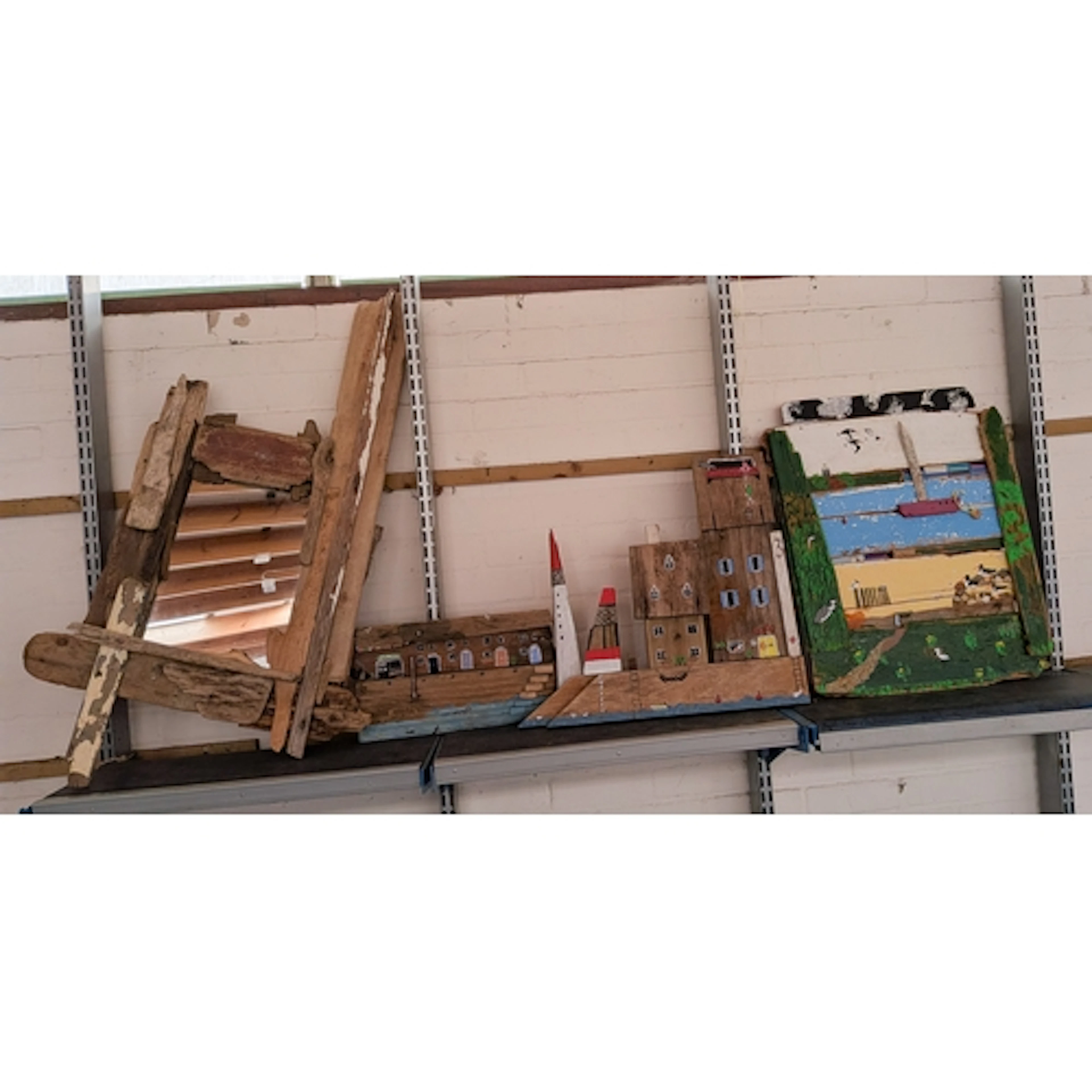 A handmade rustic style wall mirror and three painted wall h...