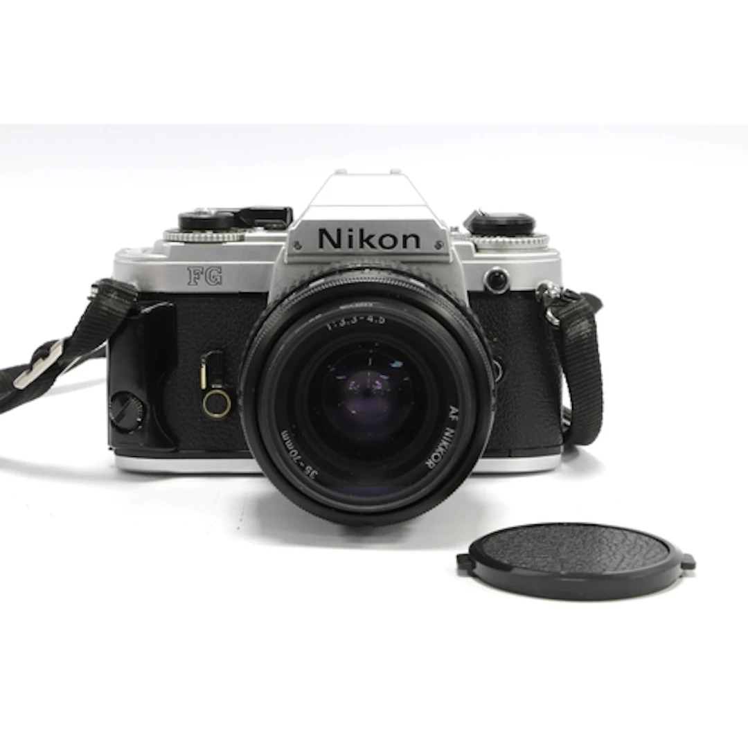 Nikon FG 35mm SLR Film Camera with attached Nikon AF Nikkor ...