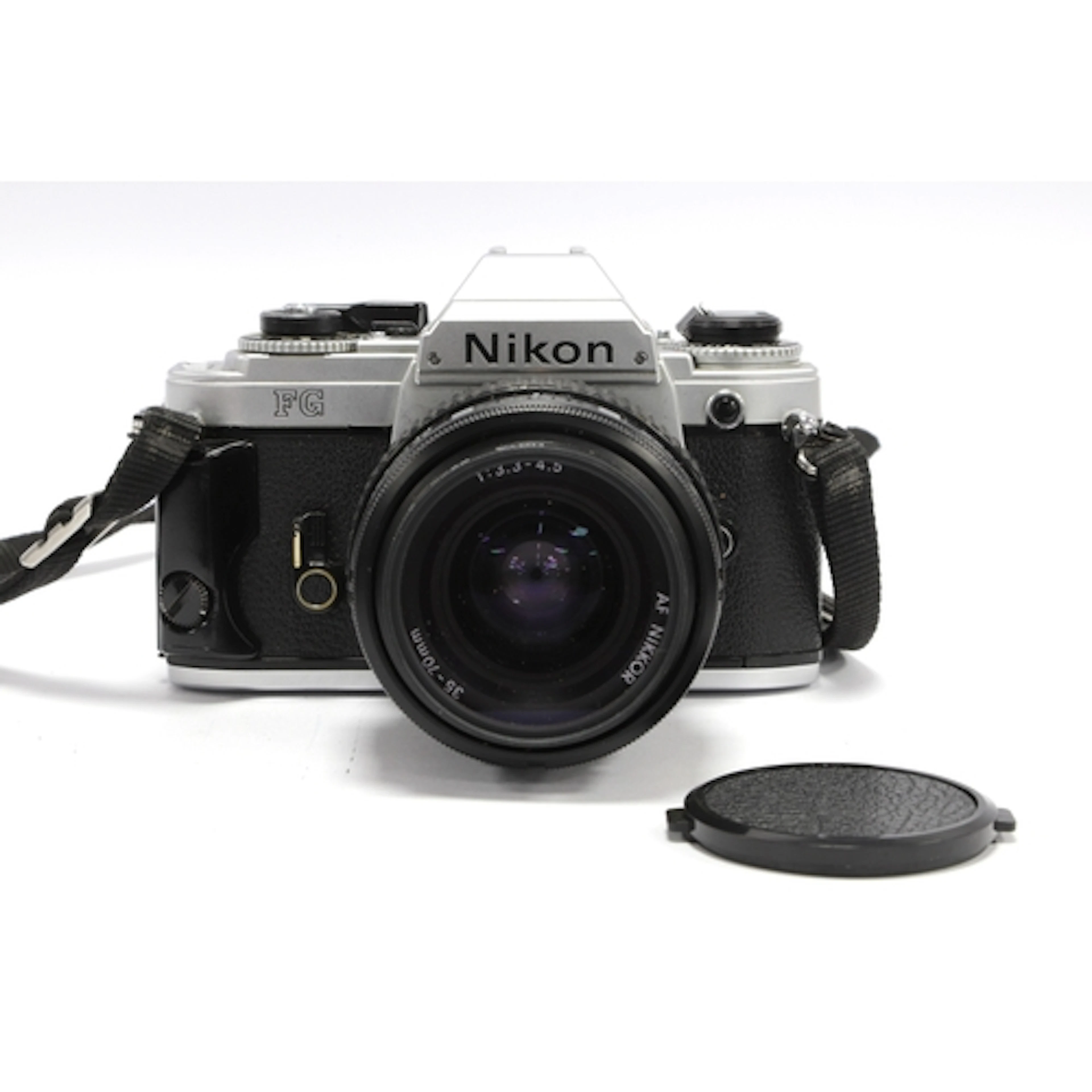 Nikon FG 35mm SLR Film Camera with attached Nikon AF Nikkor ...