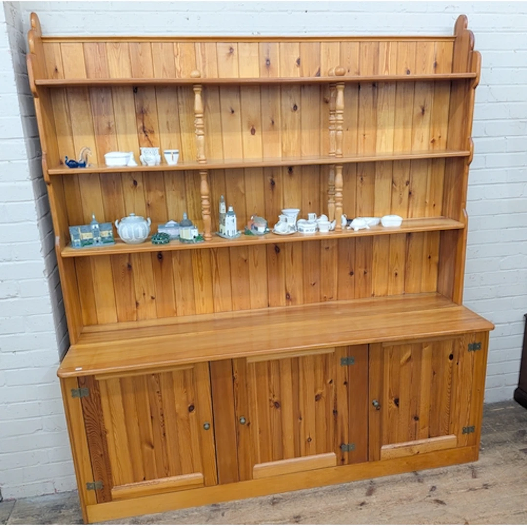 A large modern pine shelf backed dresser, 71" wide