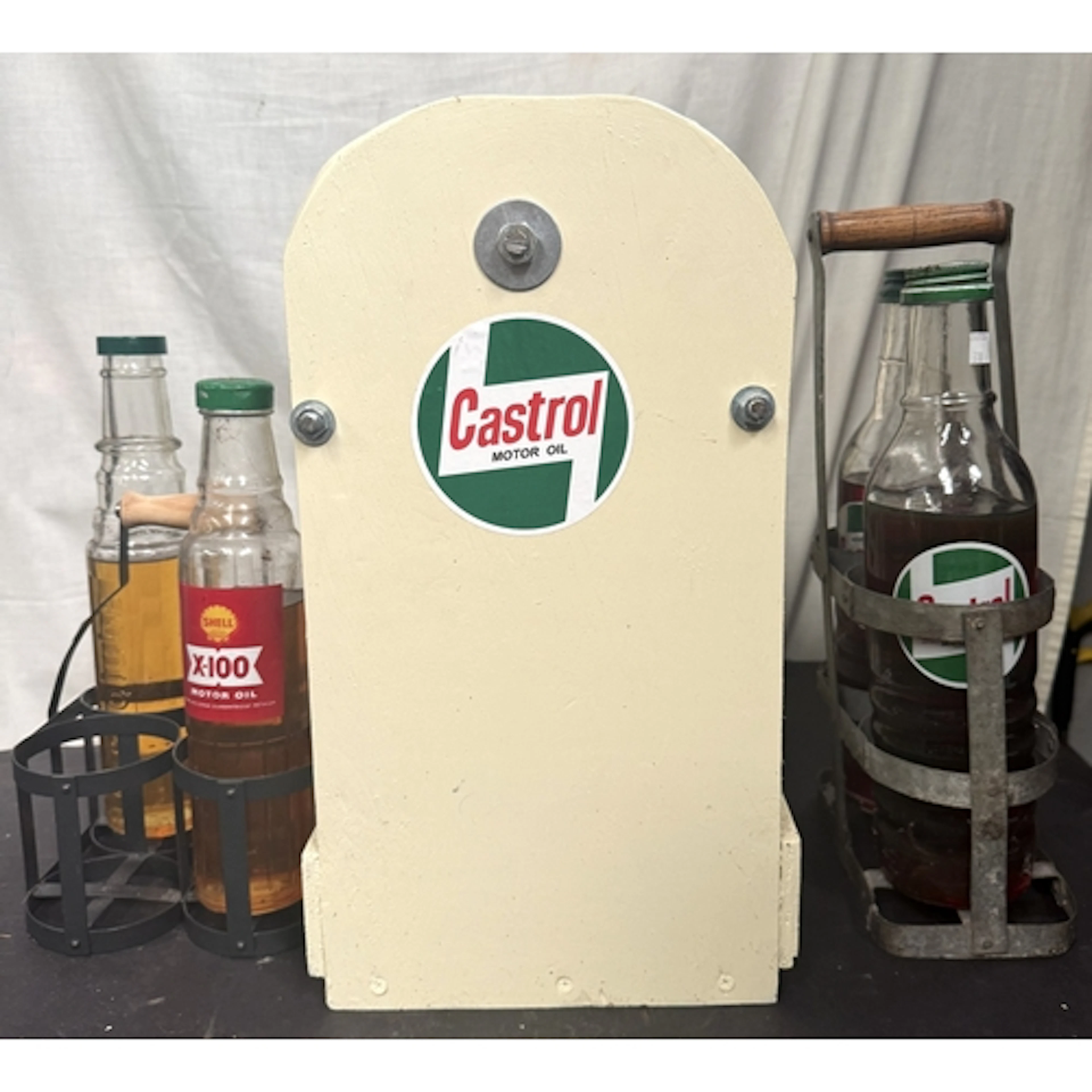 A collection of vintage Castrol and other Motor oil bottles ...
