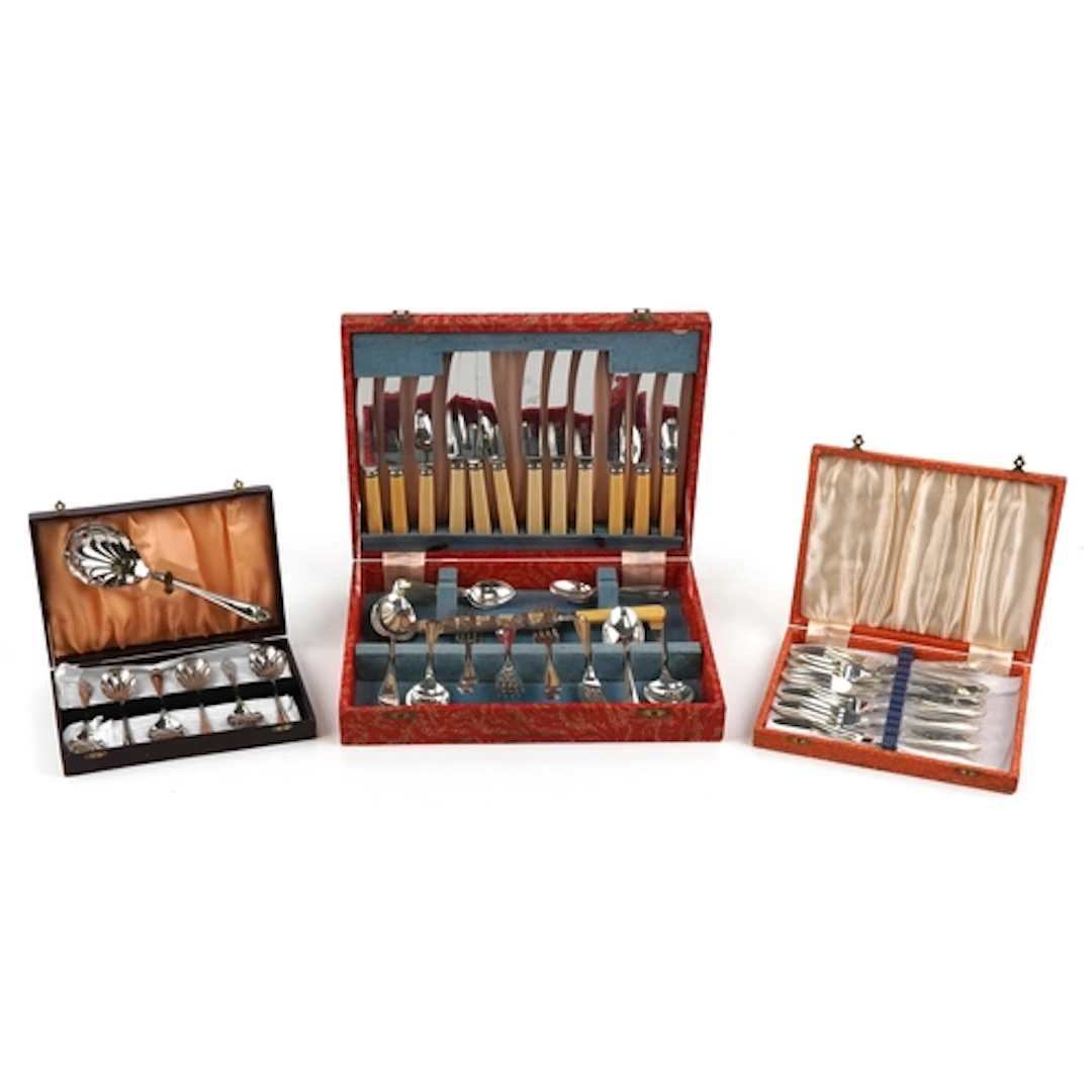 Three vintage cutlery sets comprising a six place set with i...