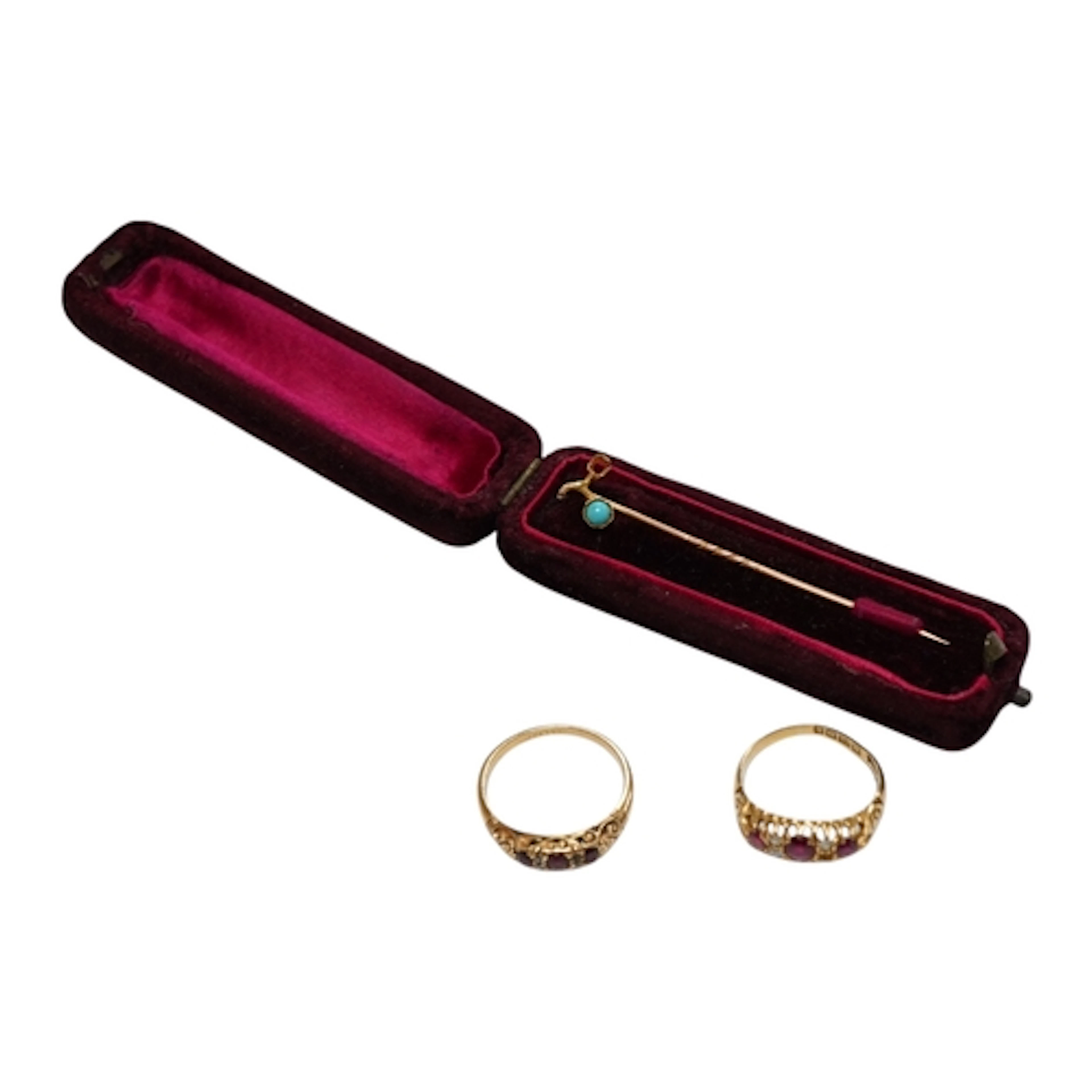 A late Victoria 18ct gold and three stone ruby set half hoop...