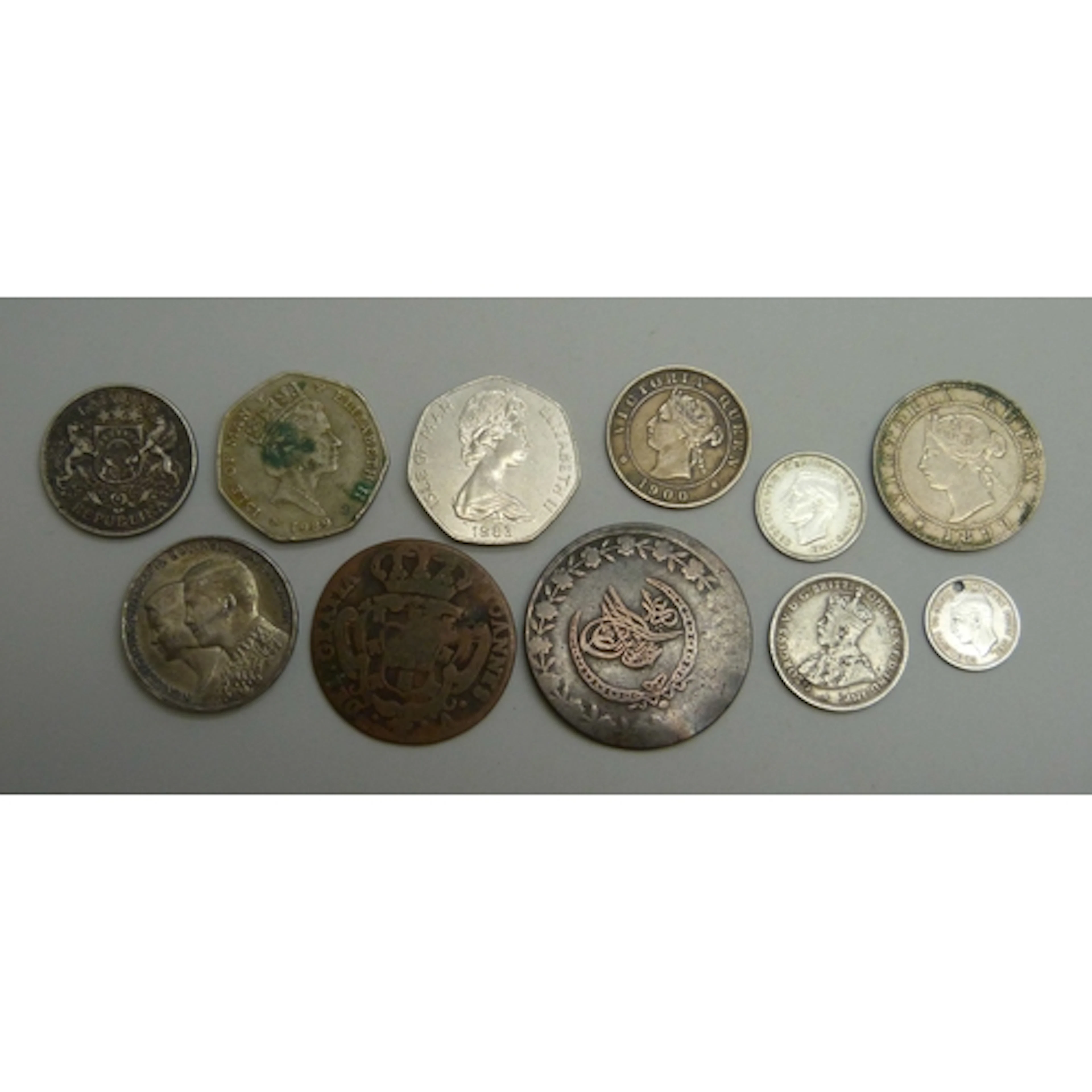 A collection of coins including Portugal, Greece, Jamaica, I...