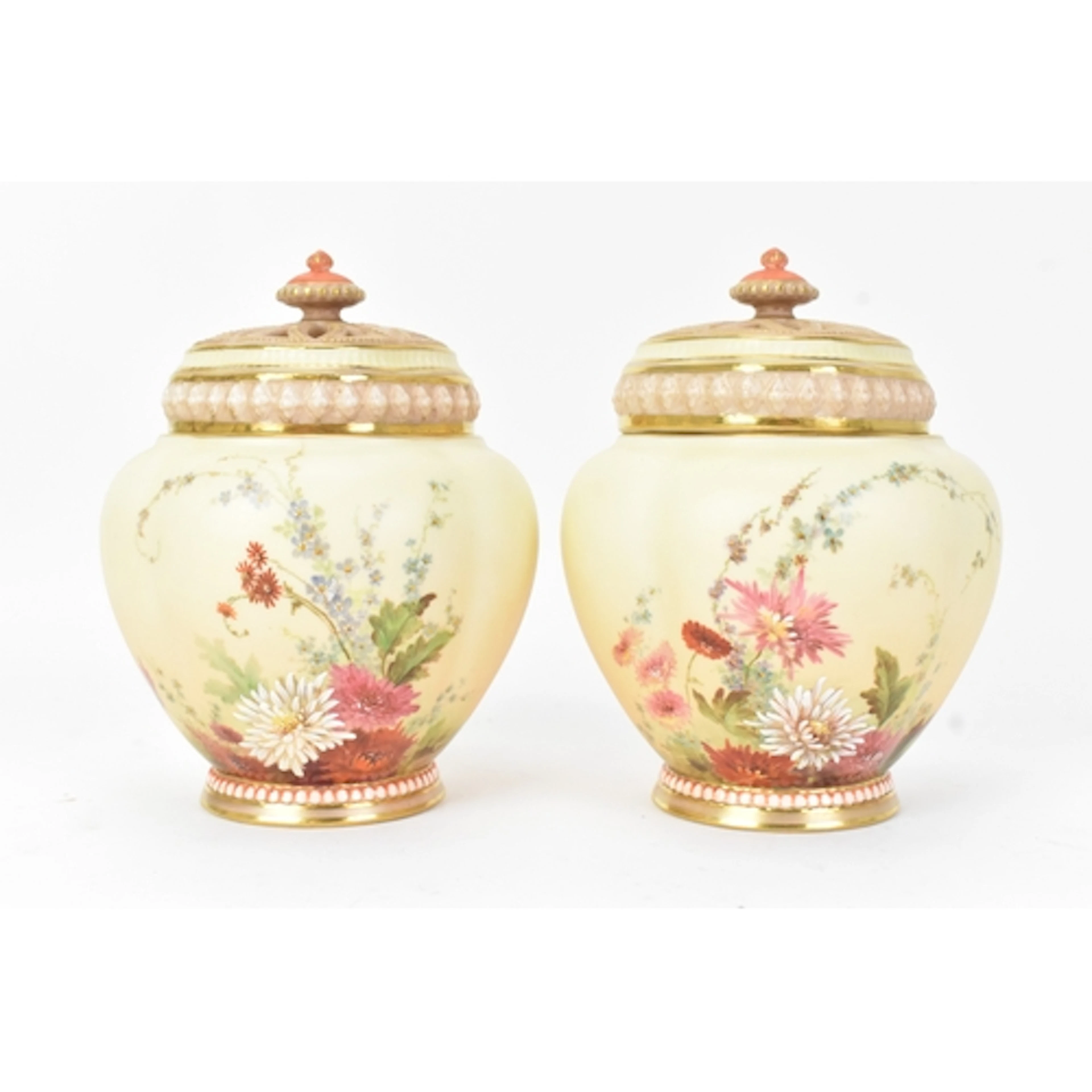 A pair of early 20th century Royal Worcester pot pourri vase...