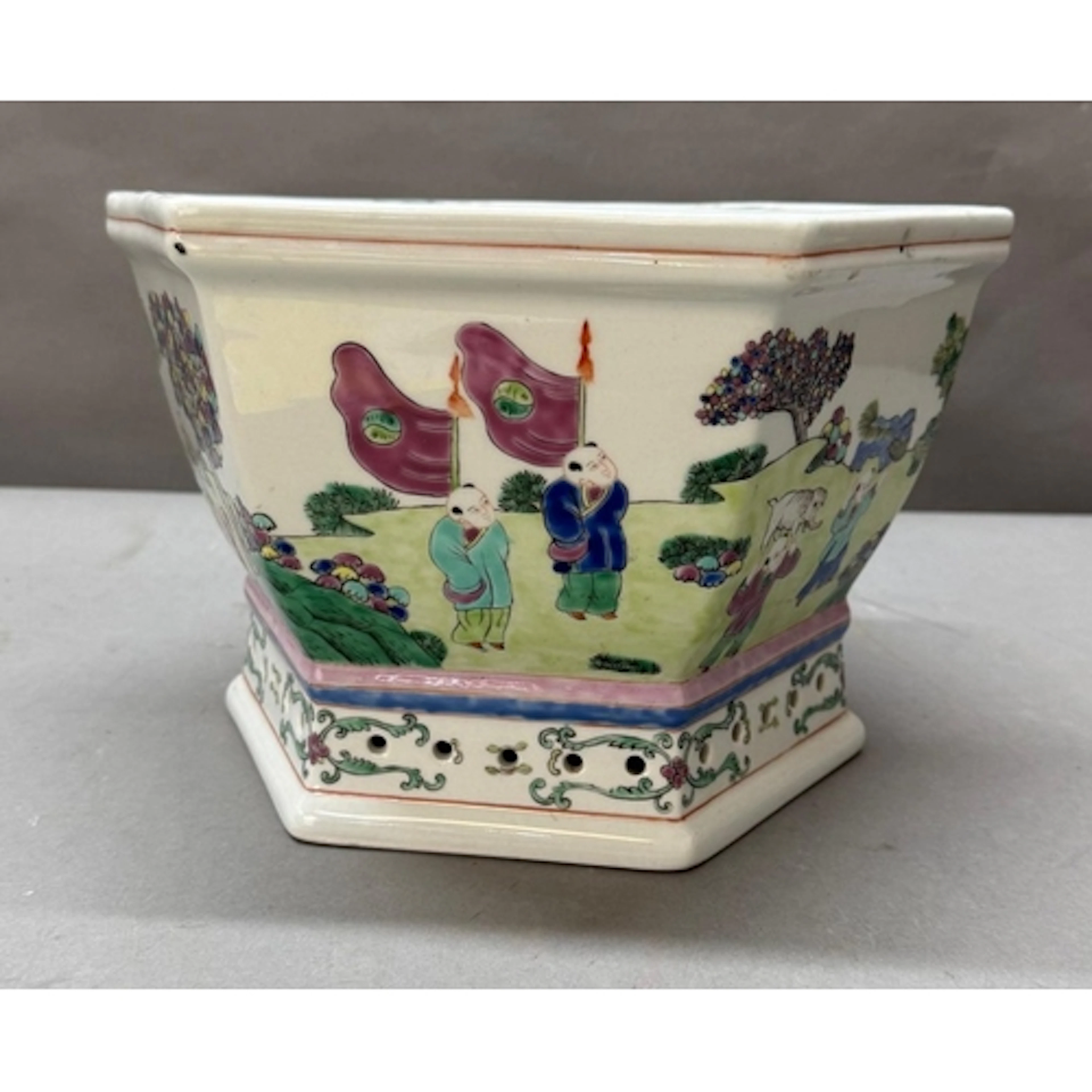 A chinese hexagonal famille rose planter featuring figural s...