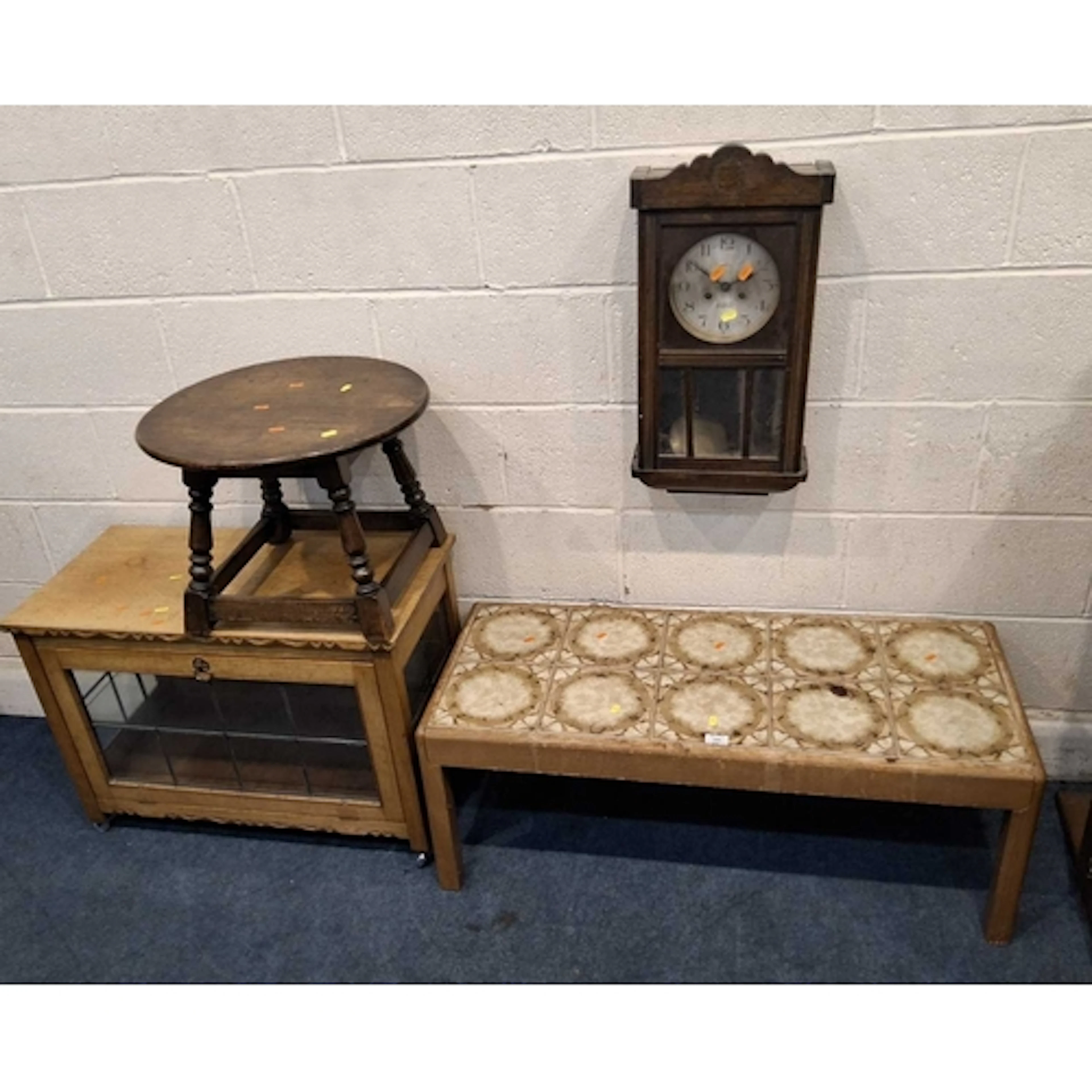 A MID-CENTURY TEAK TILE TOP COFFEE TABLE, an oak cabinet wit...
