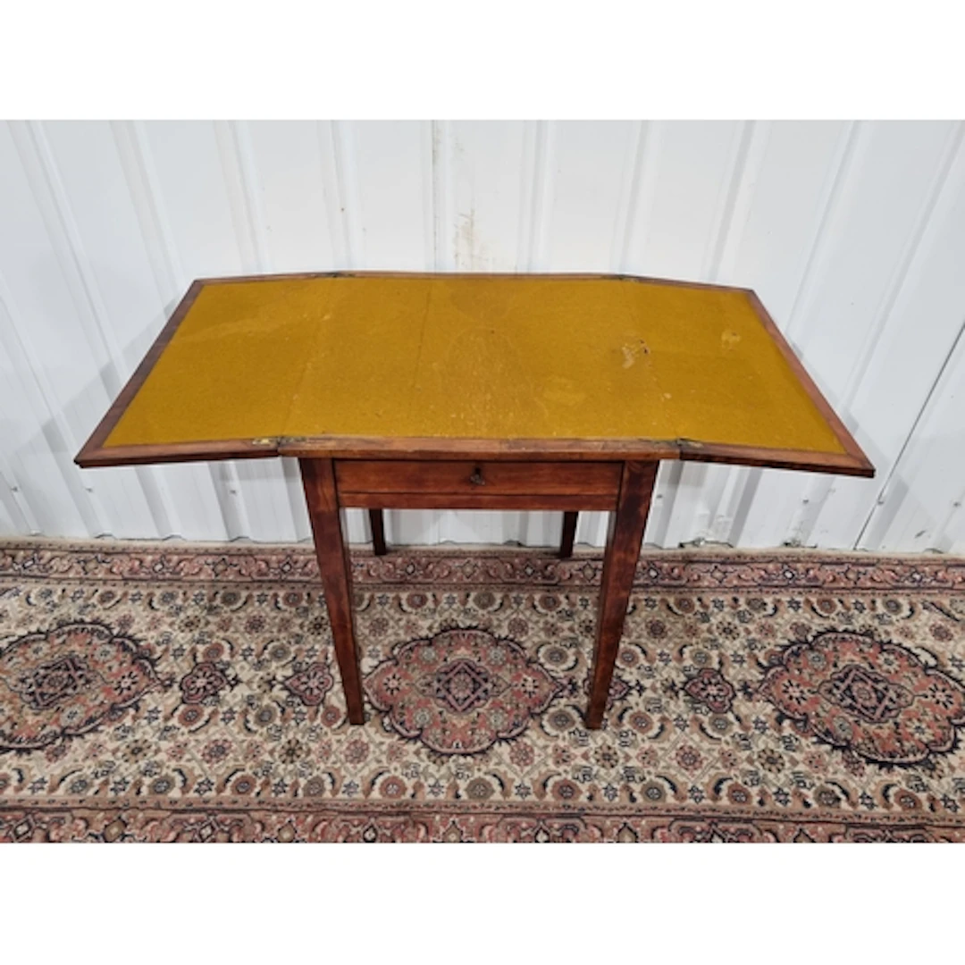 A mahogany fold out card Table raised on square supports, (R...