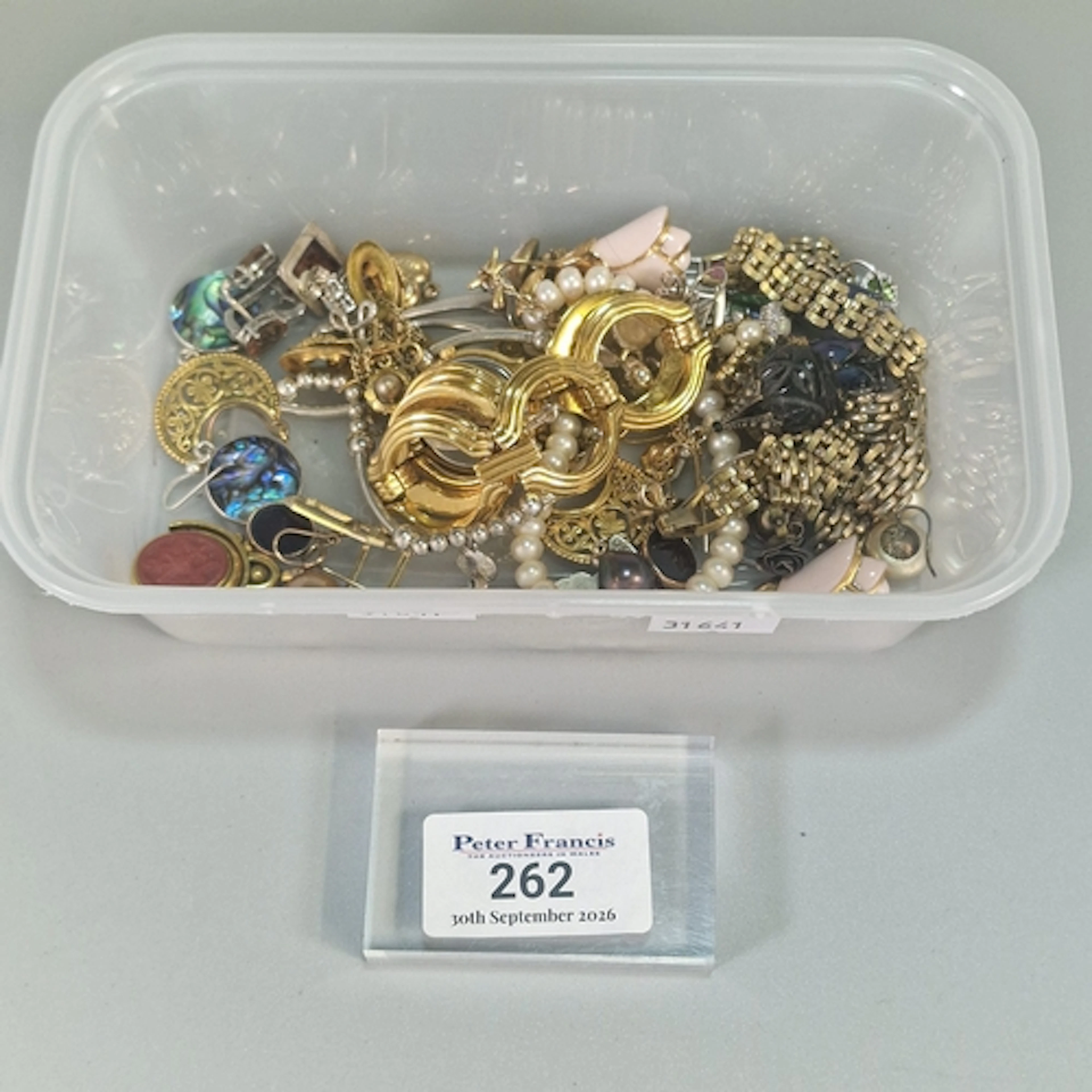 Plastic tub of mainly costume jewellery, together with some ...