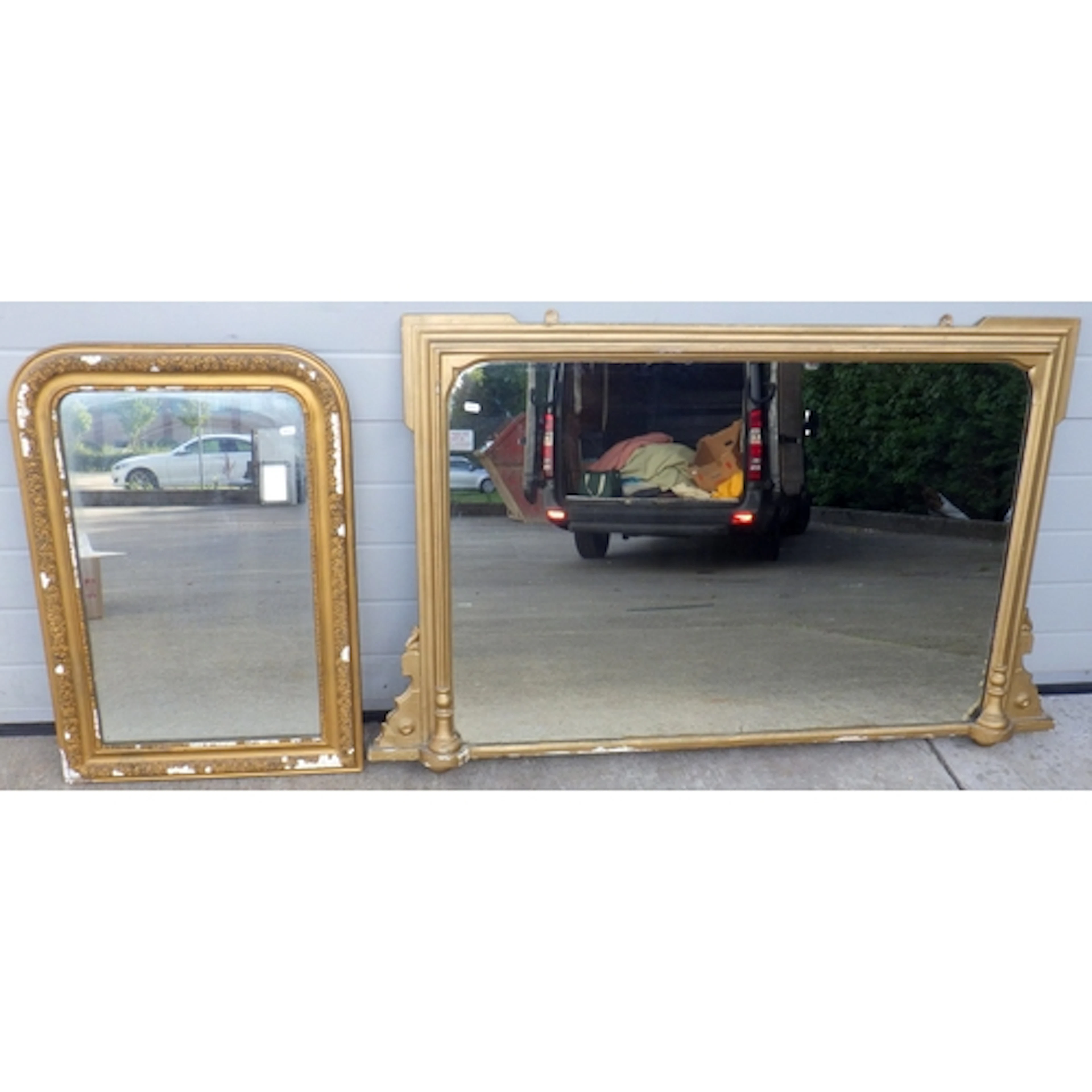 An overmantel mirror, 142cm wide and a wall mirror (2)