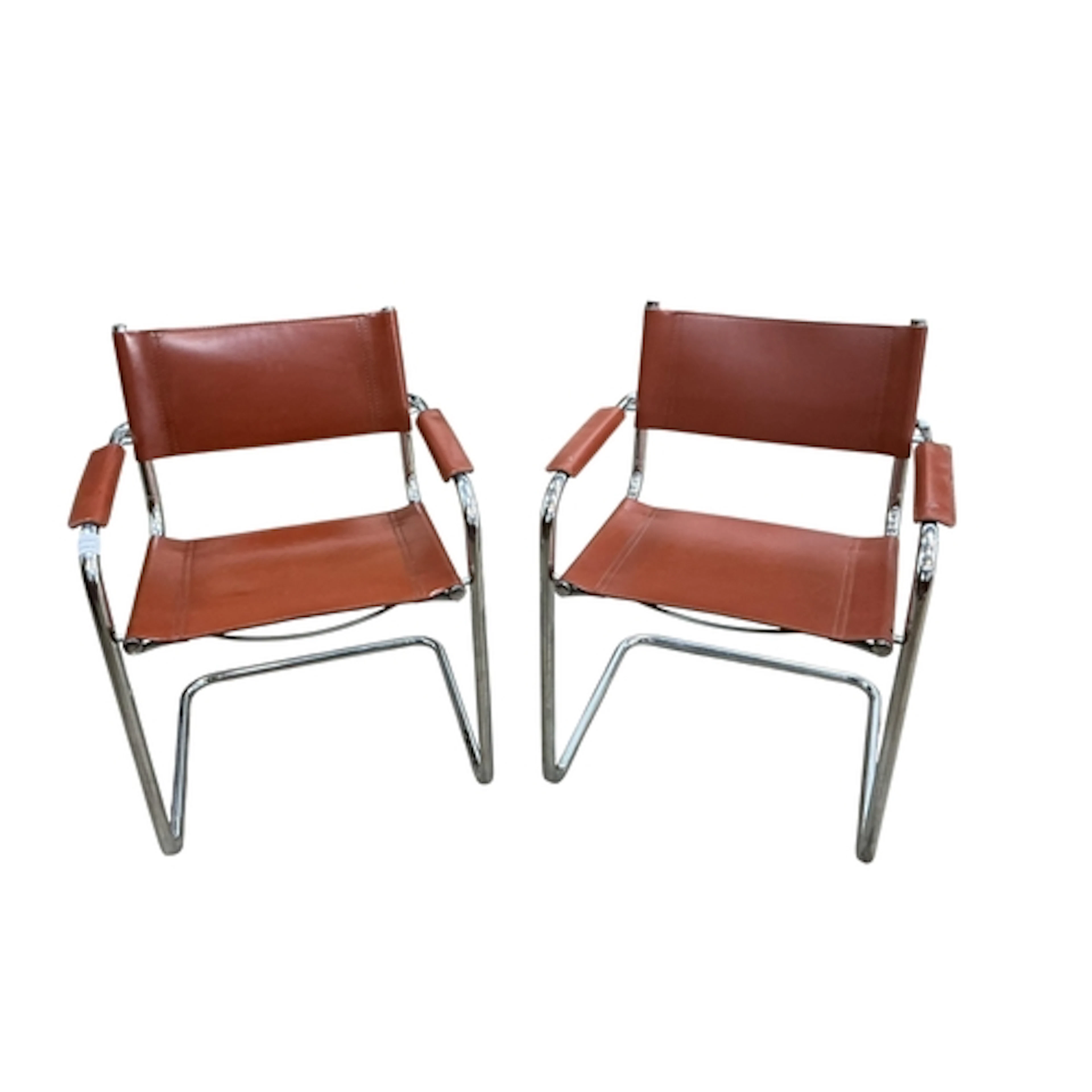 A pair of Matteo Grassi tan leather and chrome armchairs, wi...