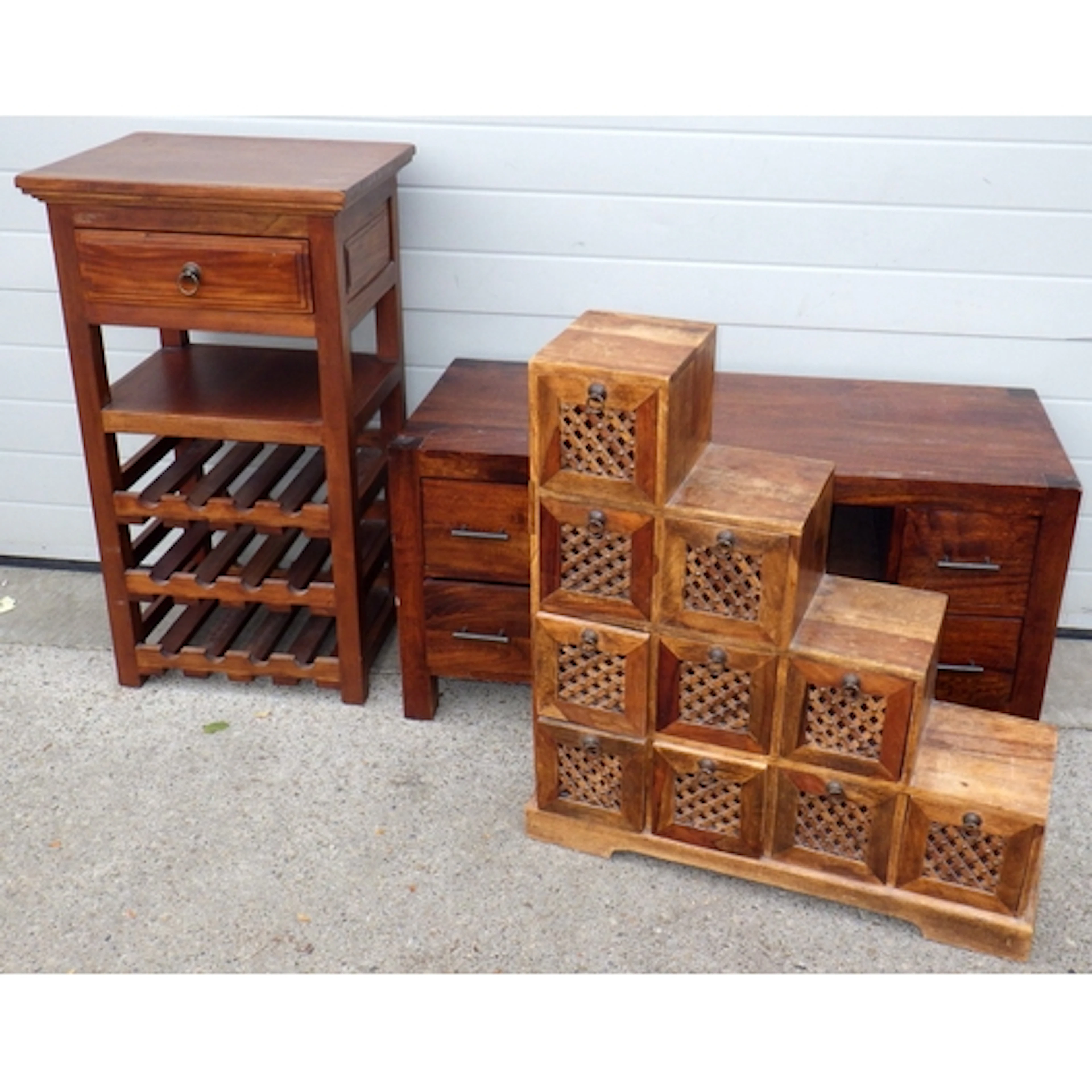A hardwood t.v stand, wine rack and a stepped set of drawers...