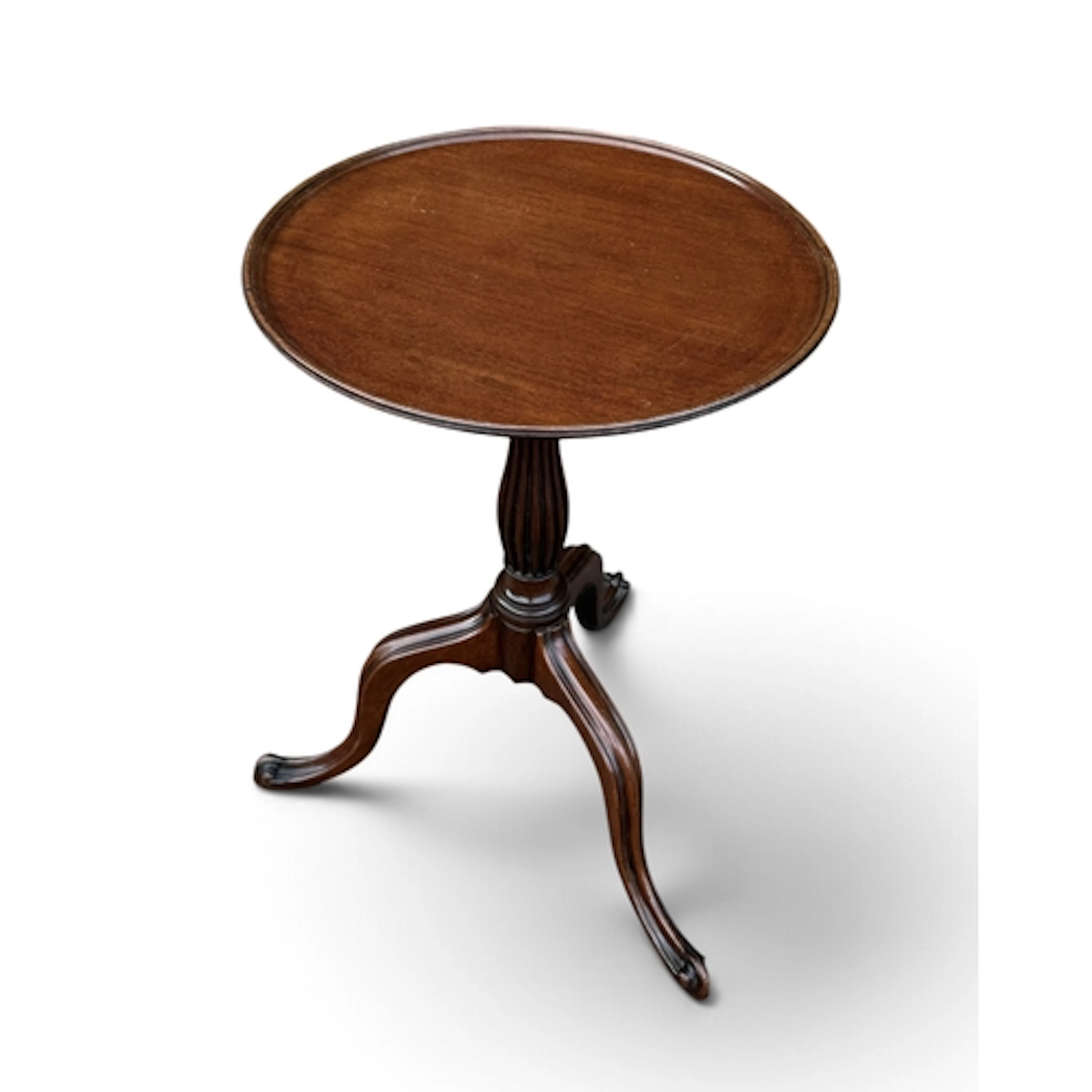 A GEORGE III STYLE WINE TABLE With circular top, on cabriole...
