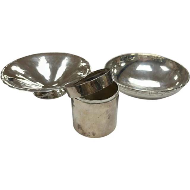 Three Arts and Crafts pieces of planished silver, unmarked, ...