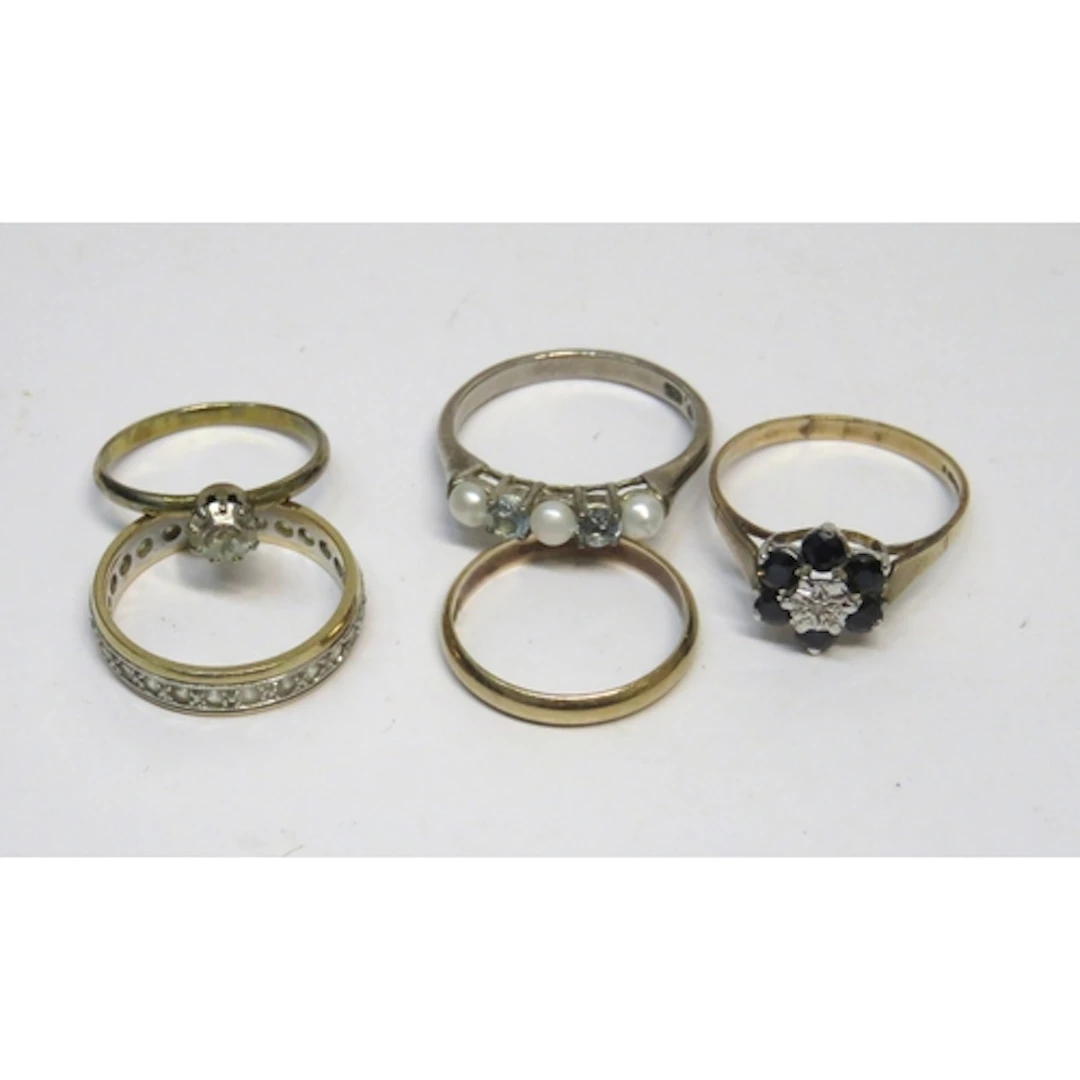 Three various 9ct gold rings, 7.2g, together with a silver r...