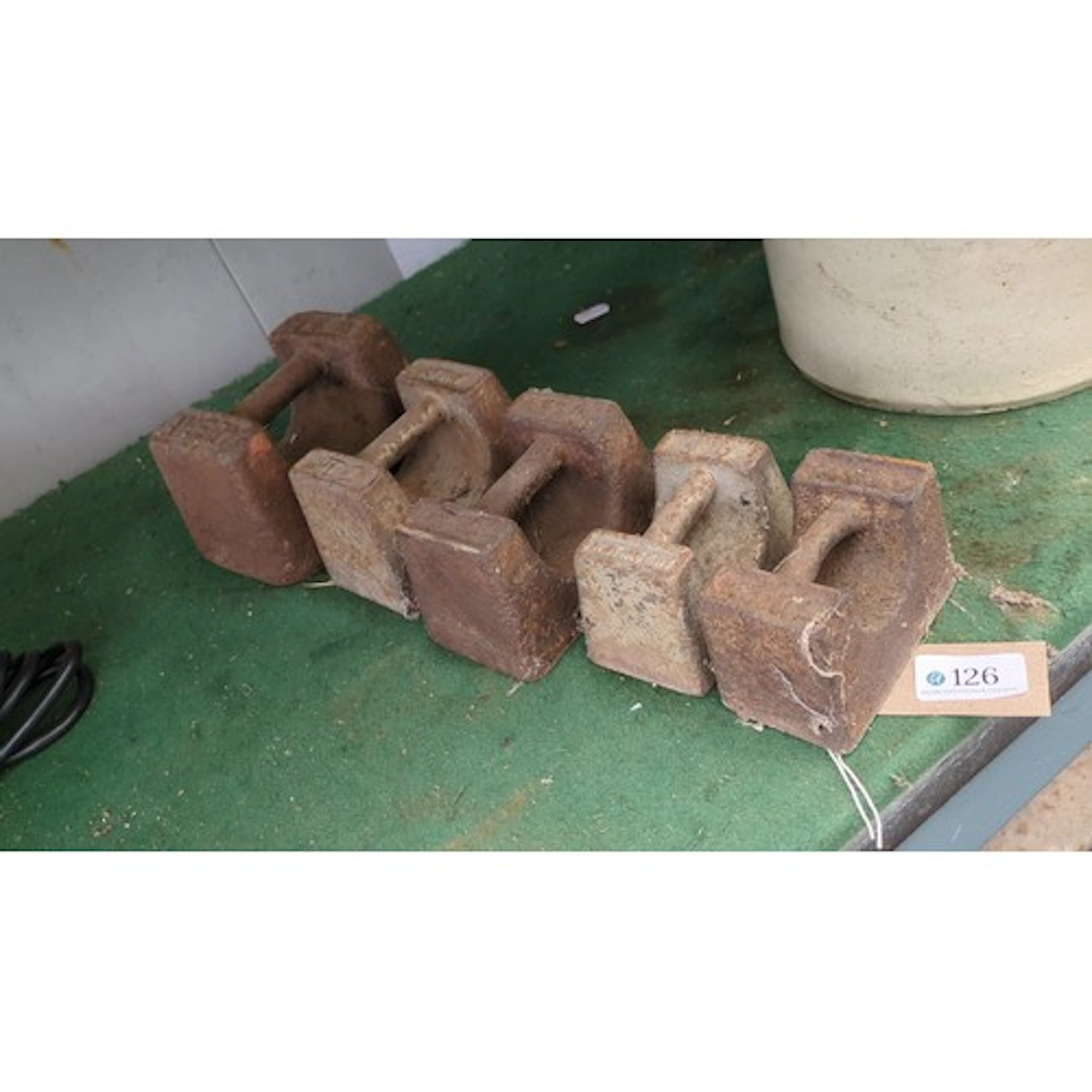 A group of cast-iron hand weights of rectangular form with i...