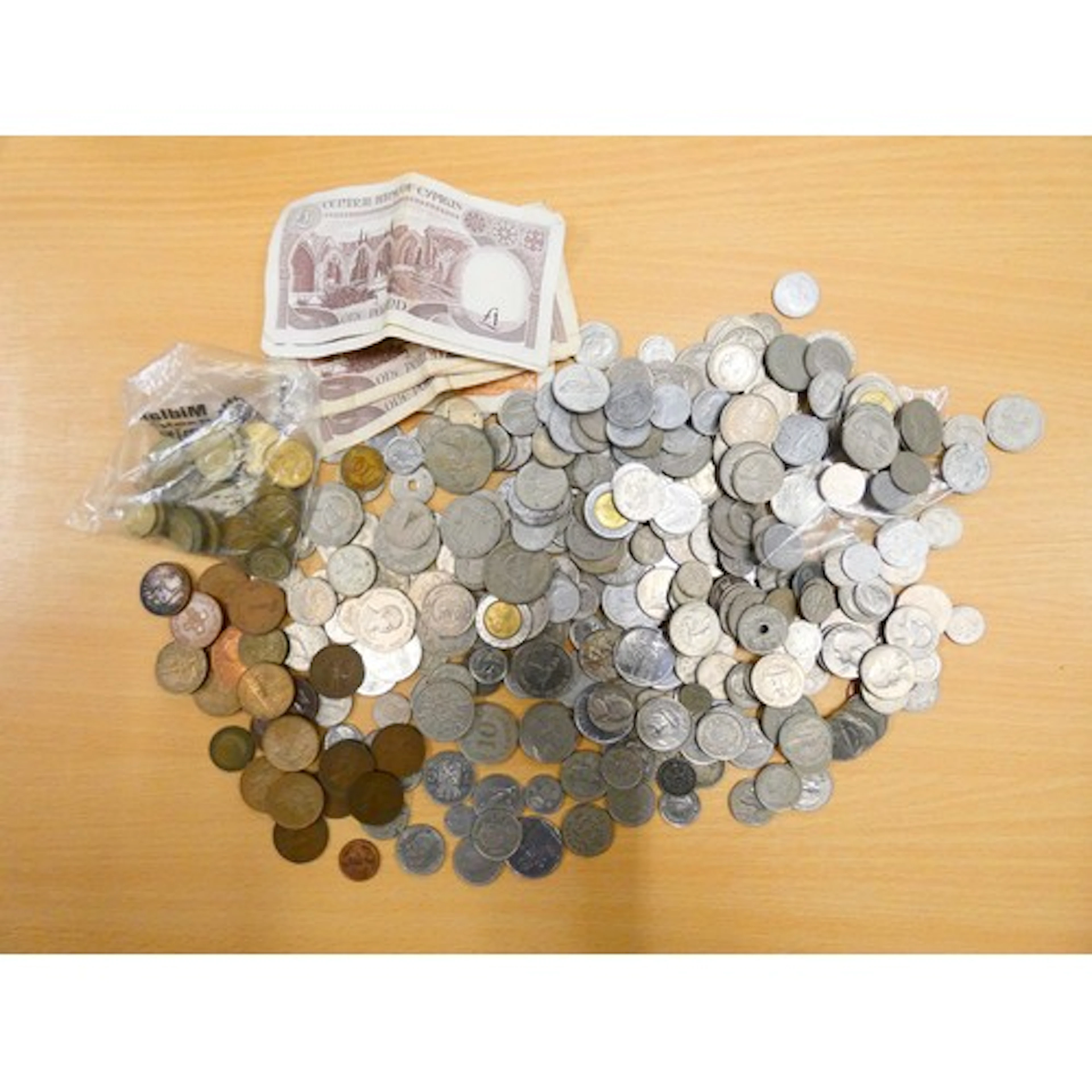 A large collection of world coins to include American quarte...