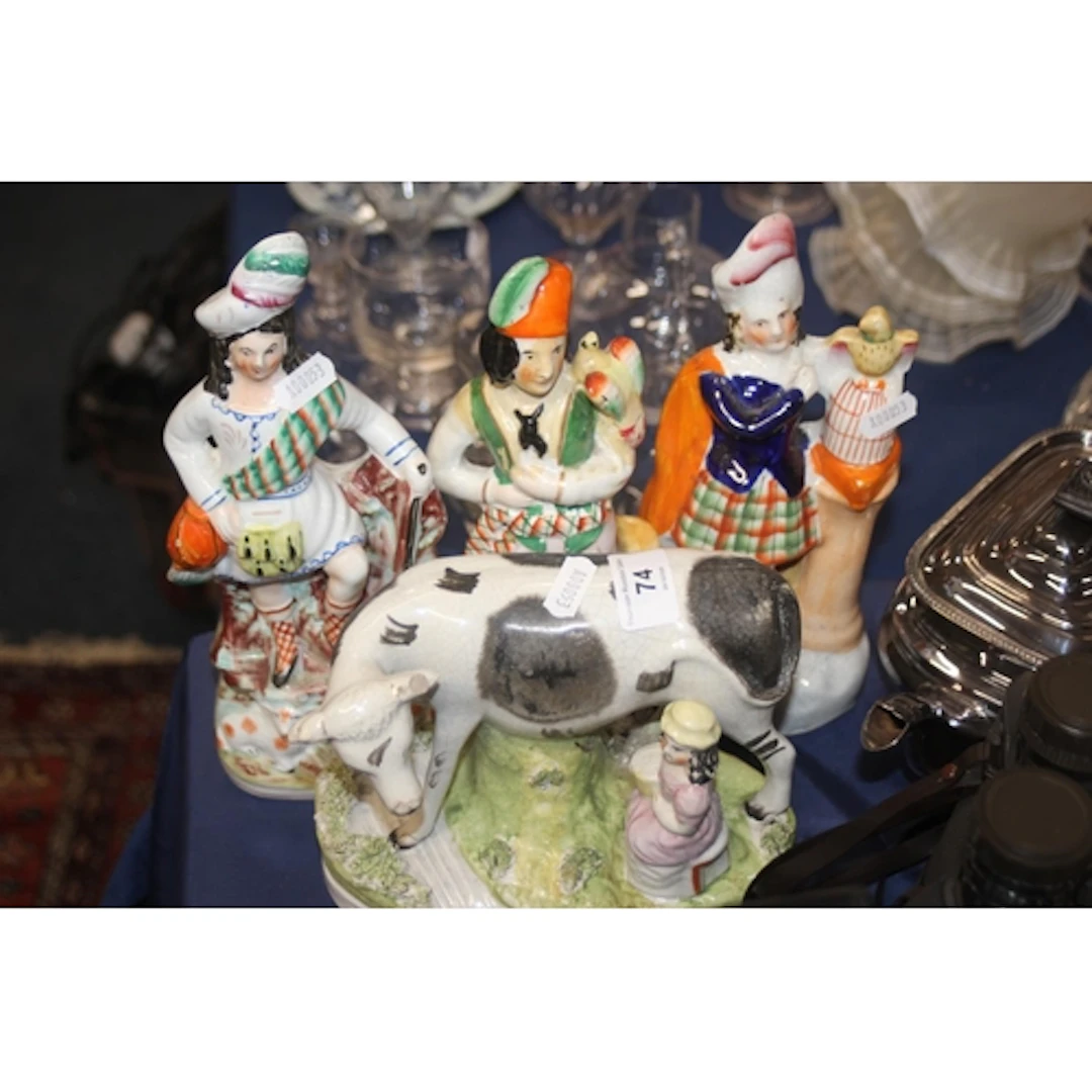Staffordshire style pottery model of a cow being milked 19cm...