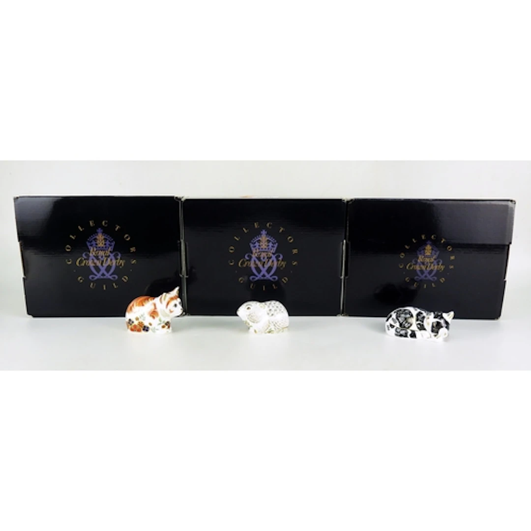 Three Royal Crown Derby Collectors Guild, paperweights inclu...