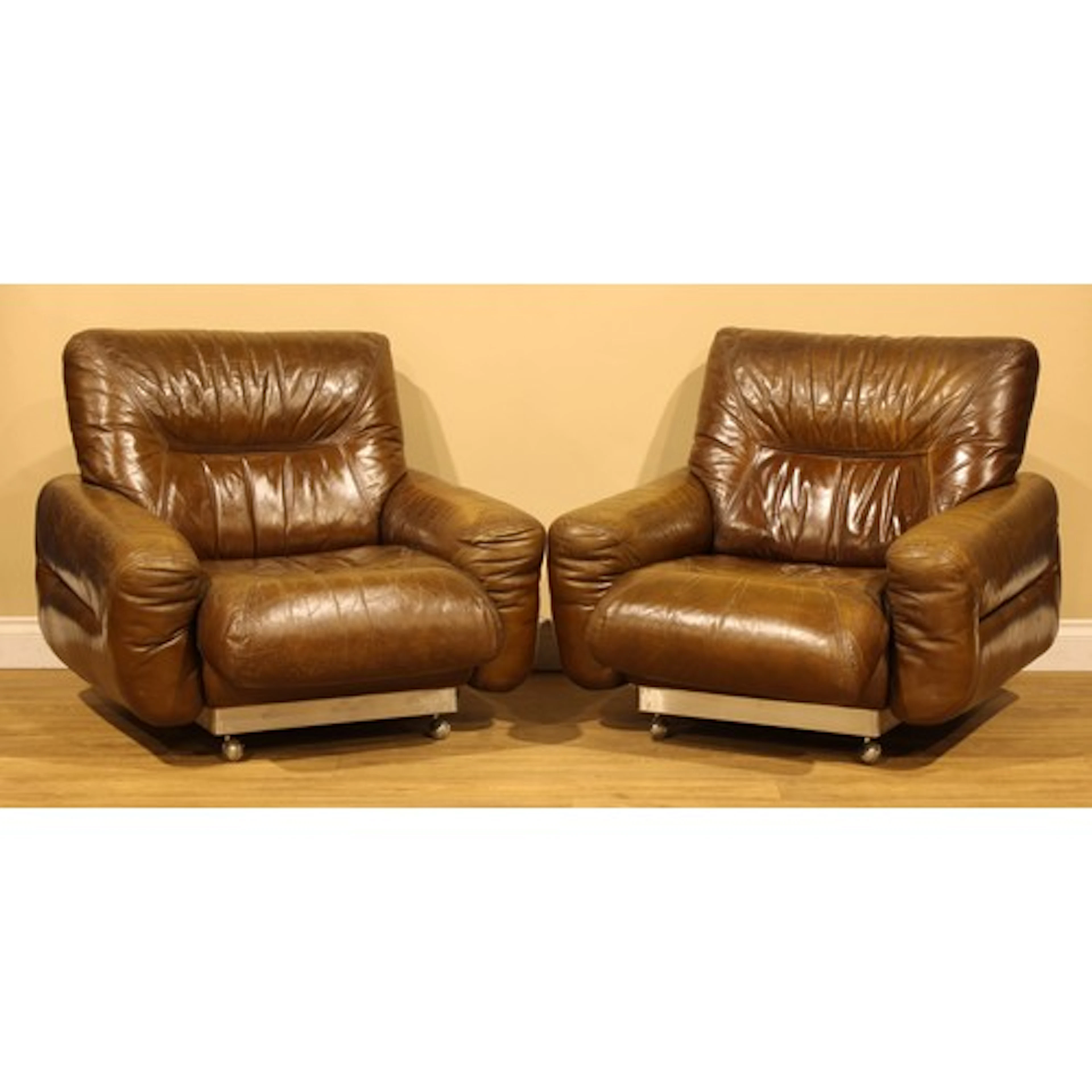 Modern Design - a pair of 1970s French leather lounge chairs...