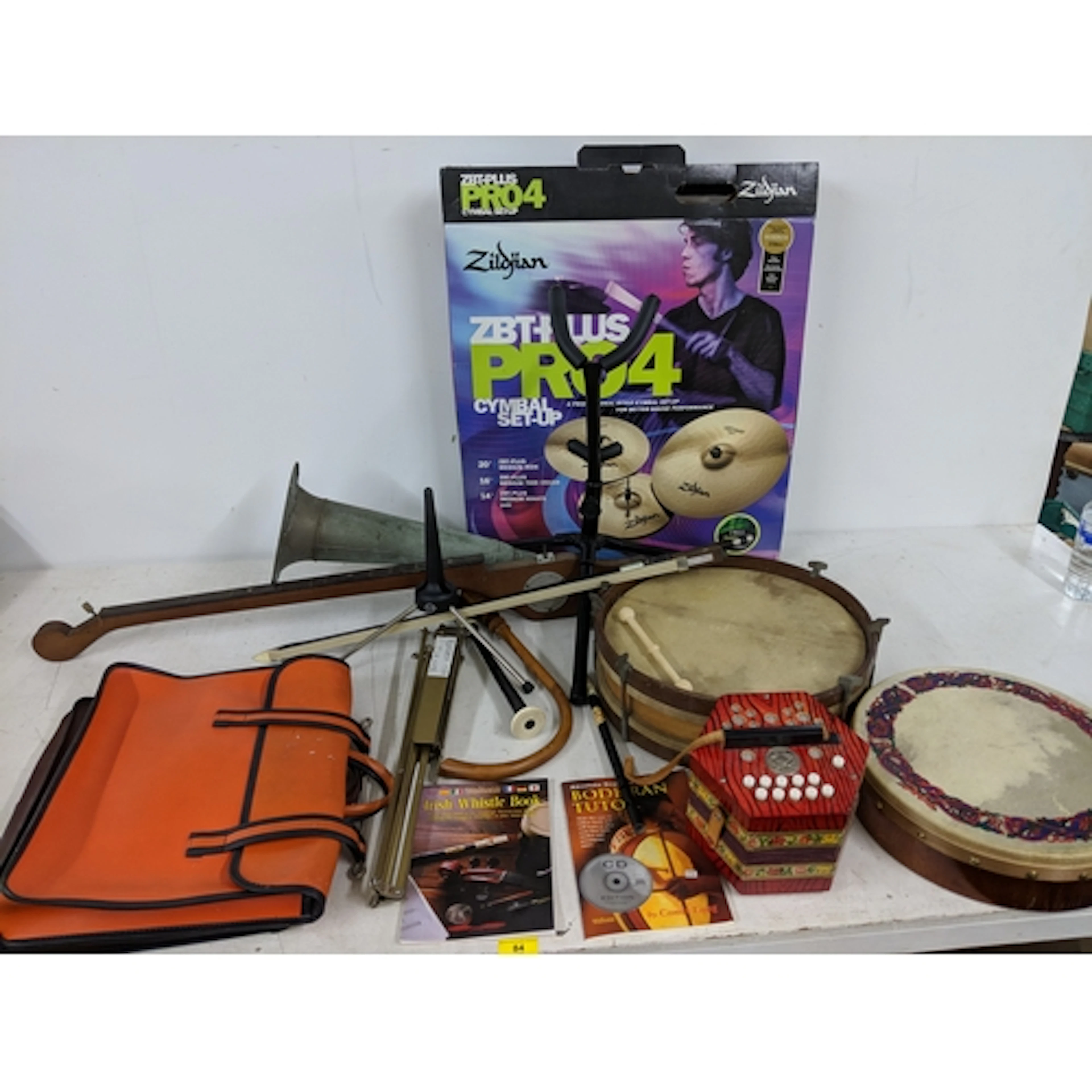 A mix of acoustic instruments to include drums, a cymbal set...