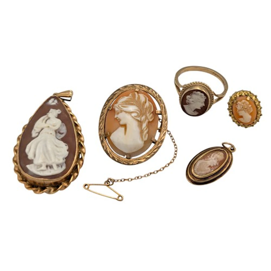 A 9ct gold mounted oval cameo brooch, similar pear drop shap...