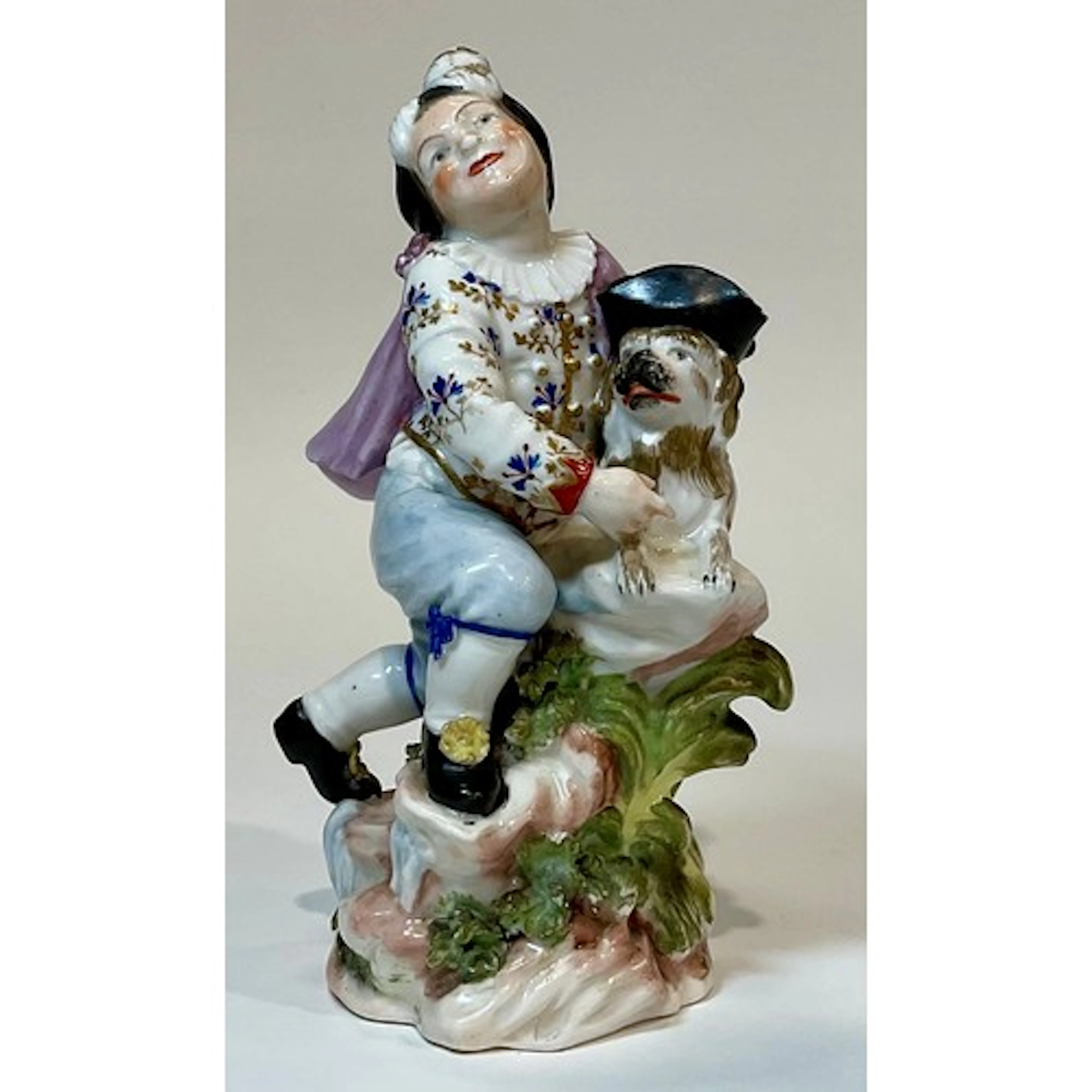 A Derby patch mark figure, Boy with Macaroni Dog, he wearing...
