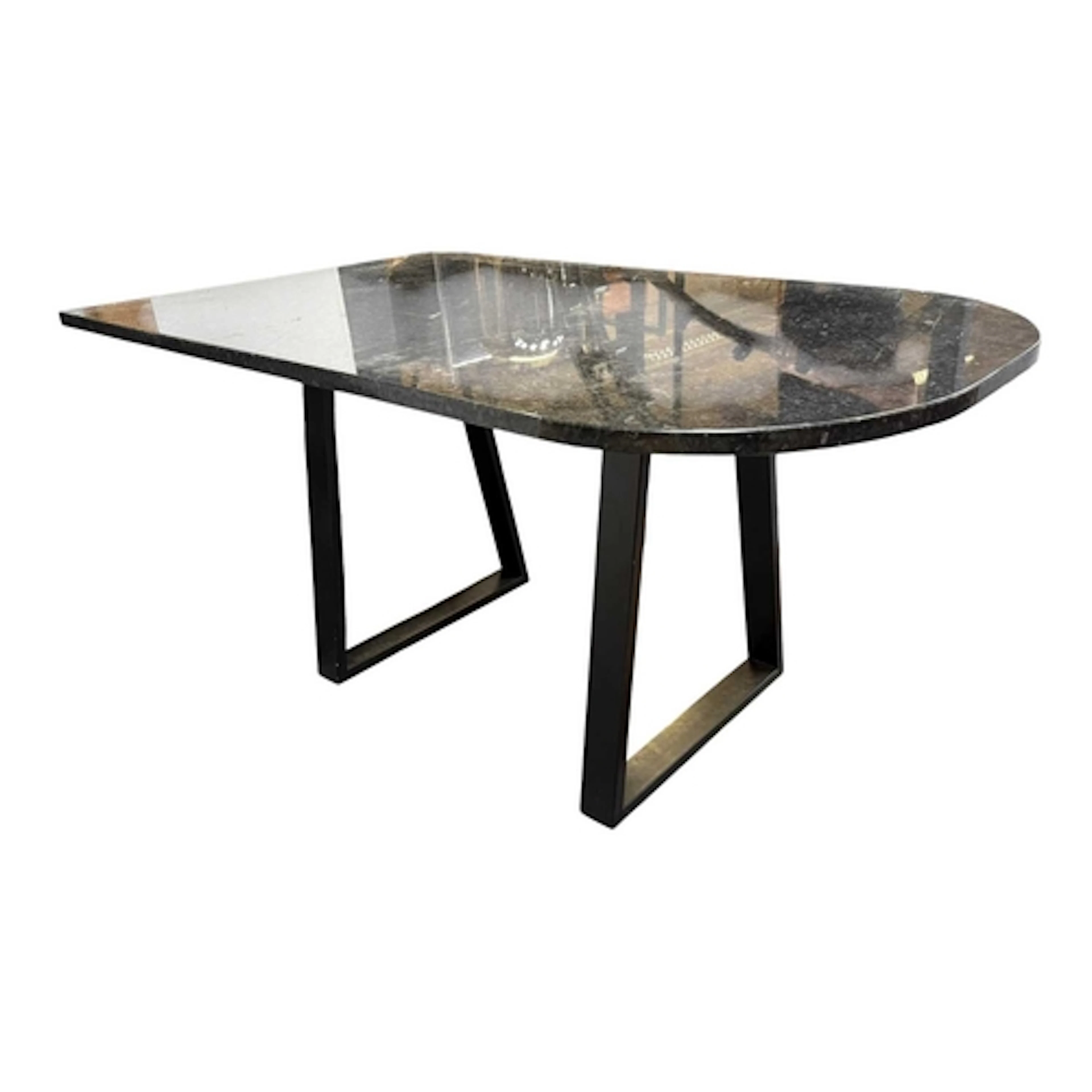 A modern designer marble top dining / kitchen table. The tab...