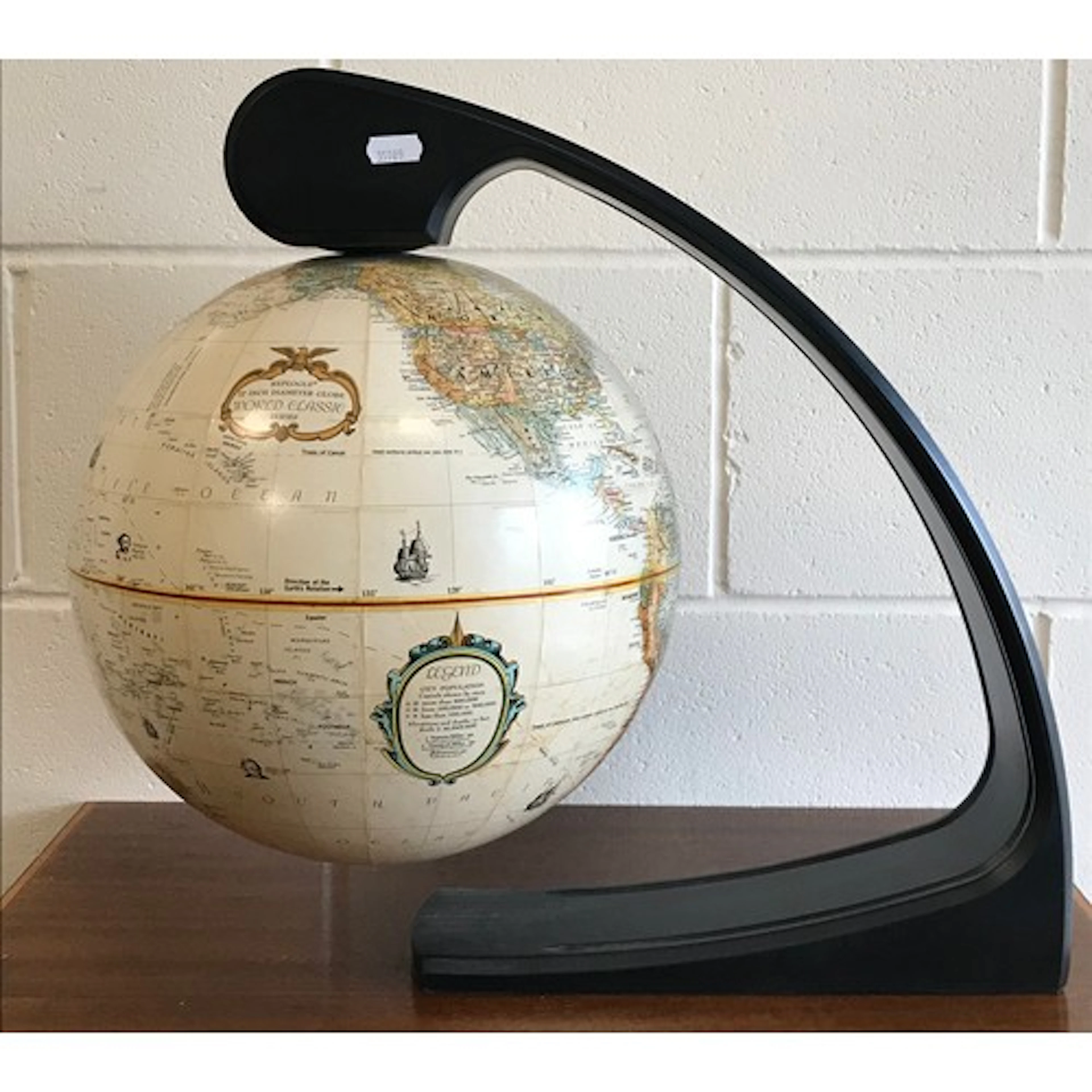 A Replogue 12" terrestrial globe on a magnetic stand, c1980s...