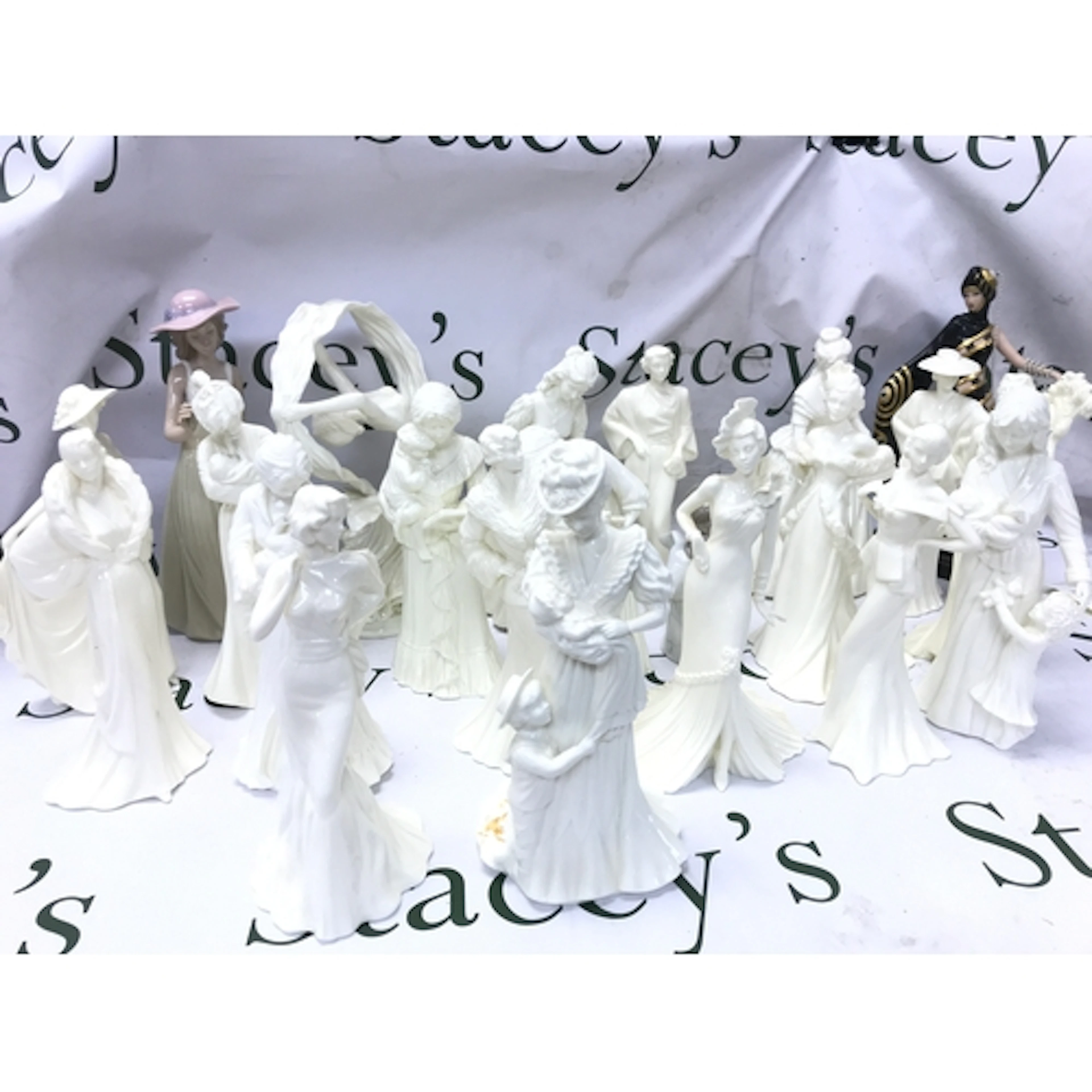 Twenty two figures including Coalport, Worcester, one Lladro...