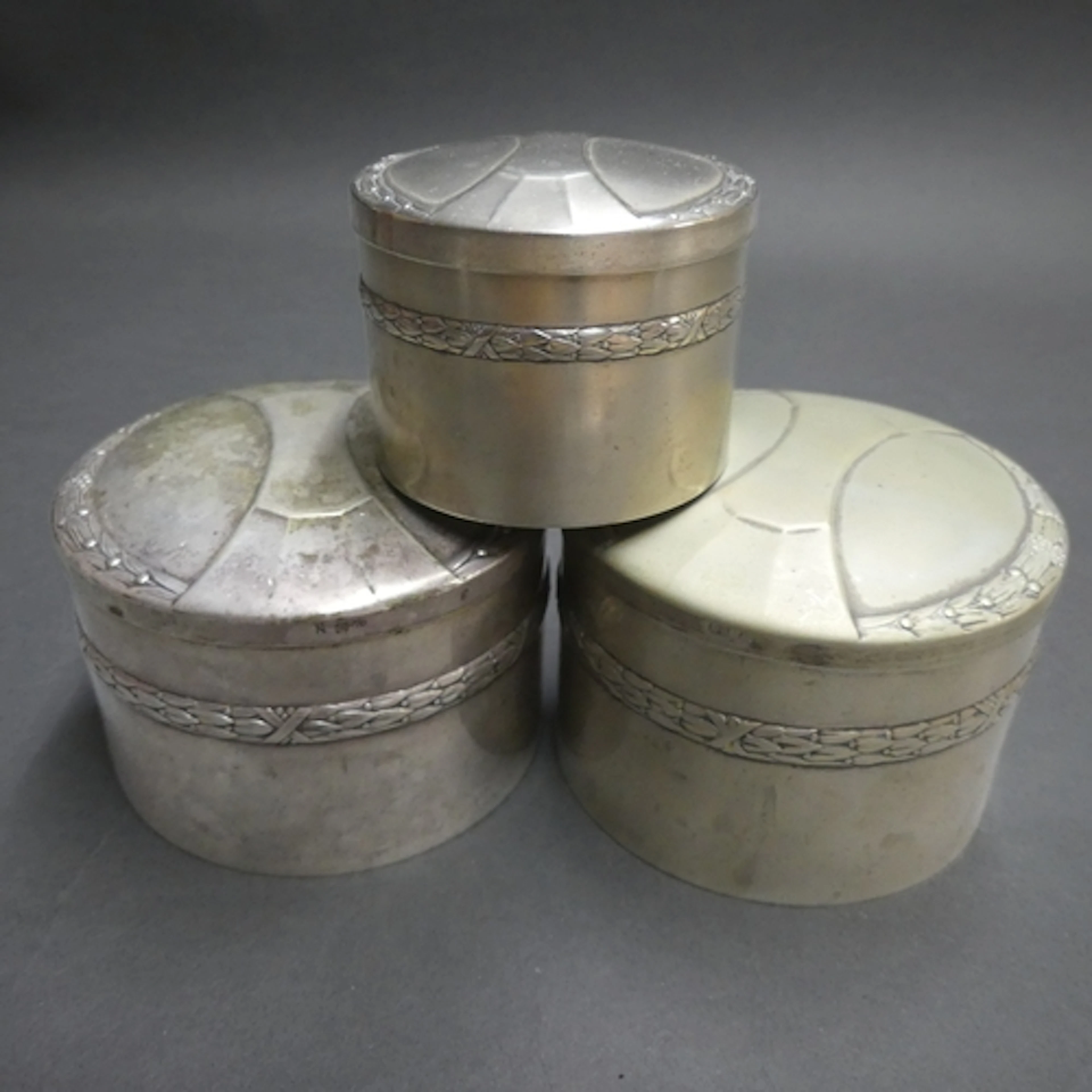 WMF - A trio of Art Nouveau silver plated lidded jars of sec...
