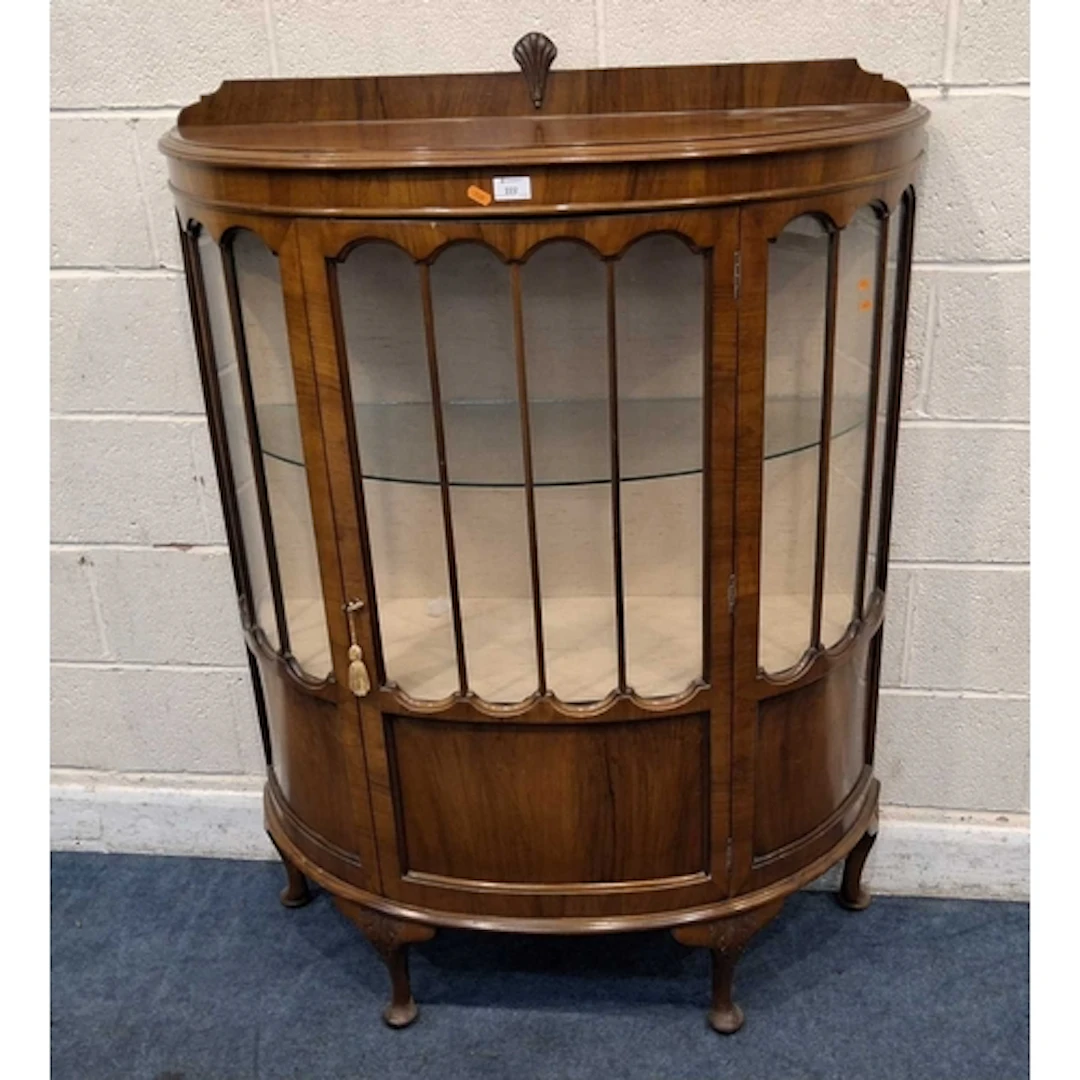 AN EARLY 20TH CENTURY DEMI-LINE DISPLAY CABINET, with a sing...