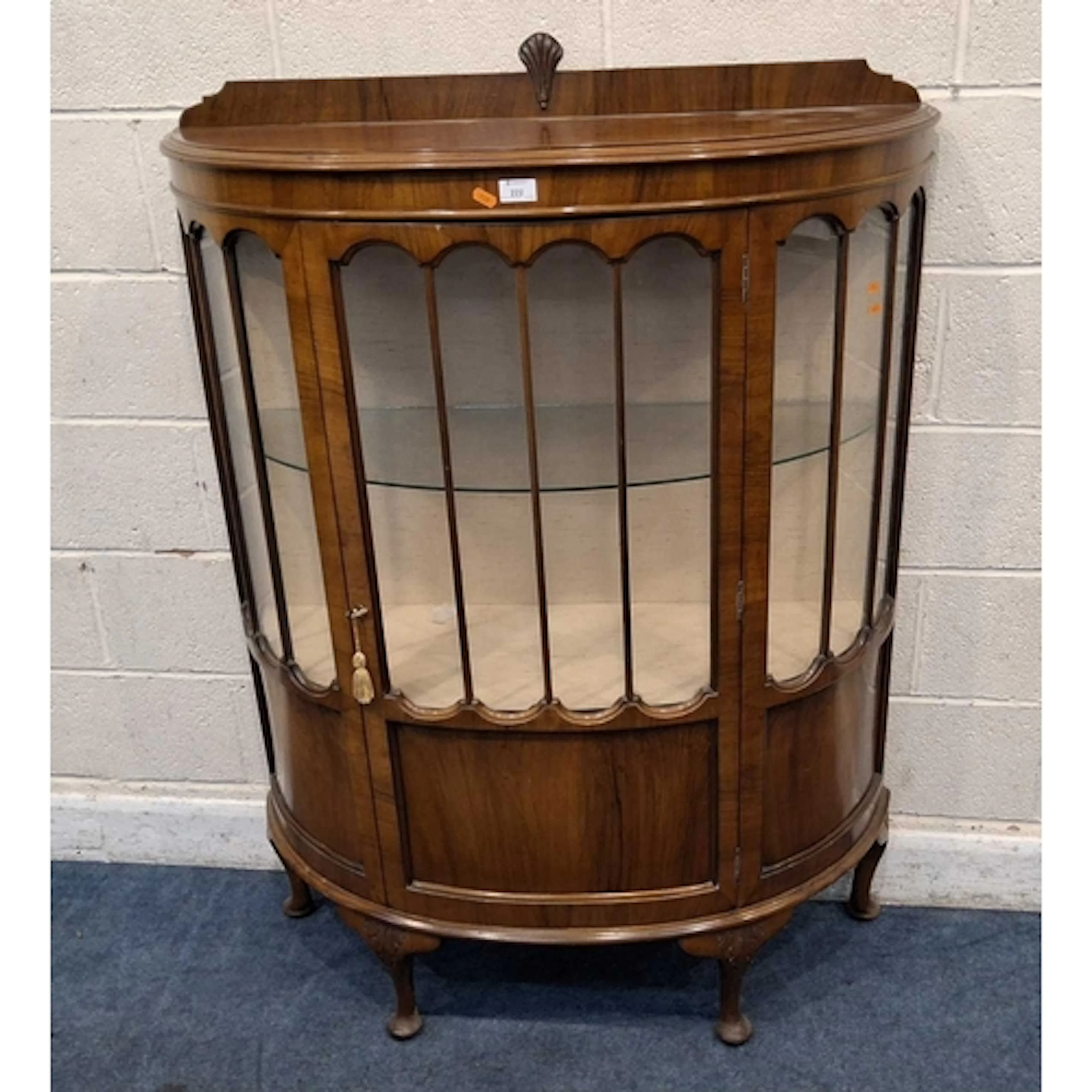 AN EARLY 20TH CENTURY DEMI-LINE DISPLAY CABINET, with a sing...