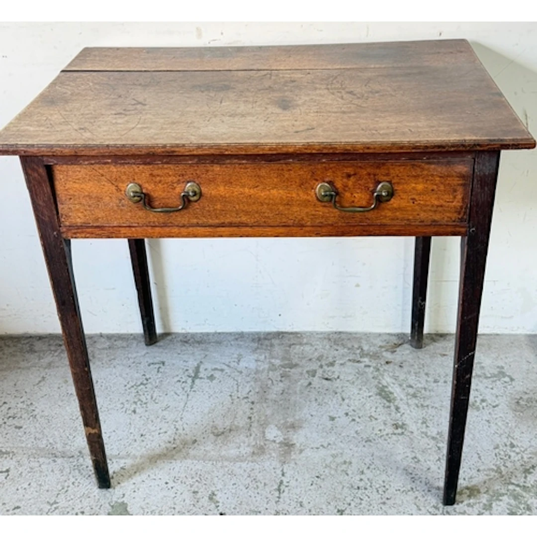 A single oak side table with drawer to centre on tapering le...